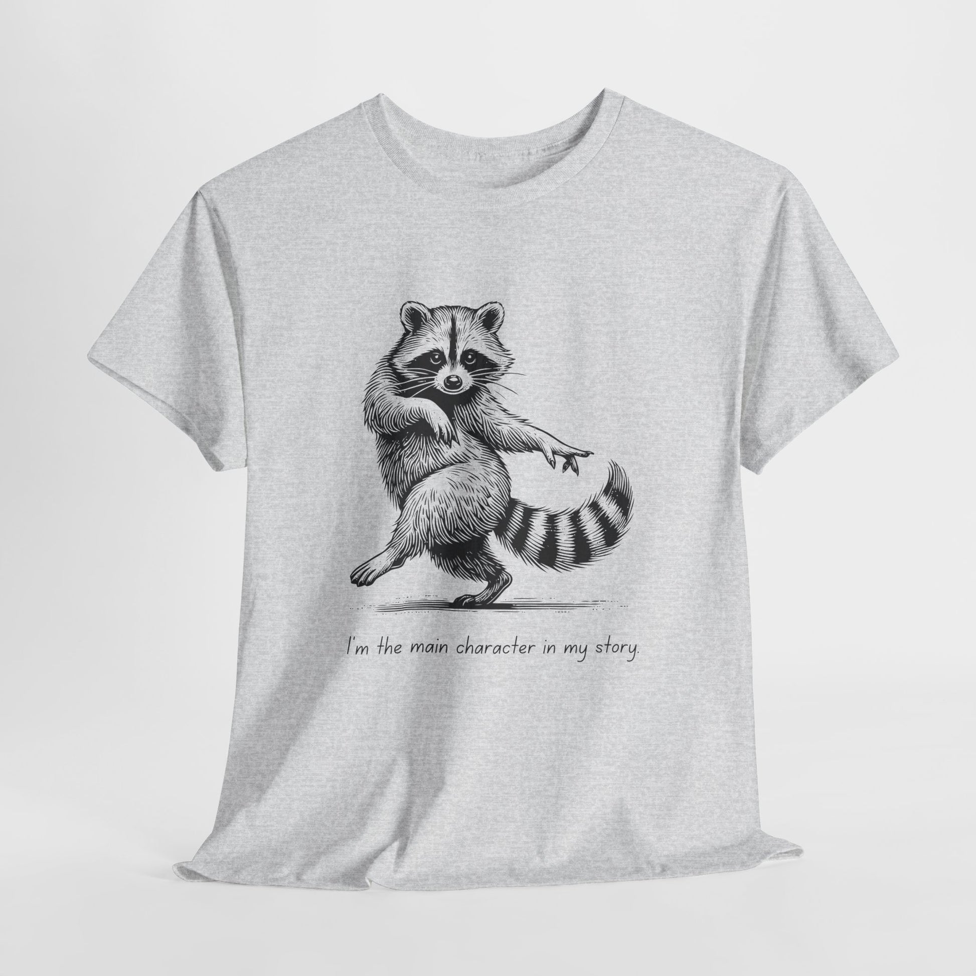 Gray t-shirt with a black sketch of a dancing racoon and text 'I'm the main character in my story.' 