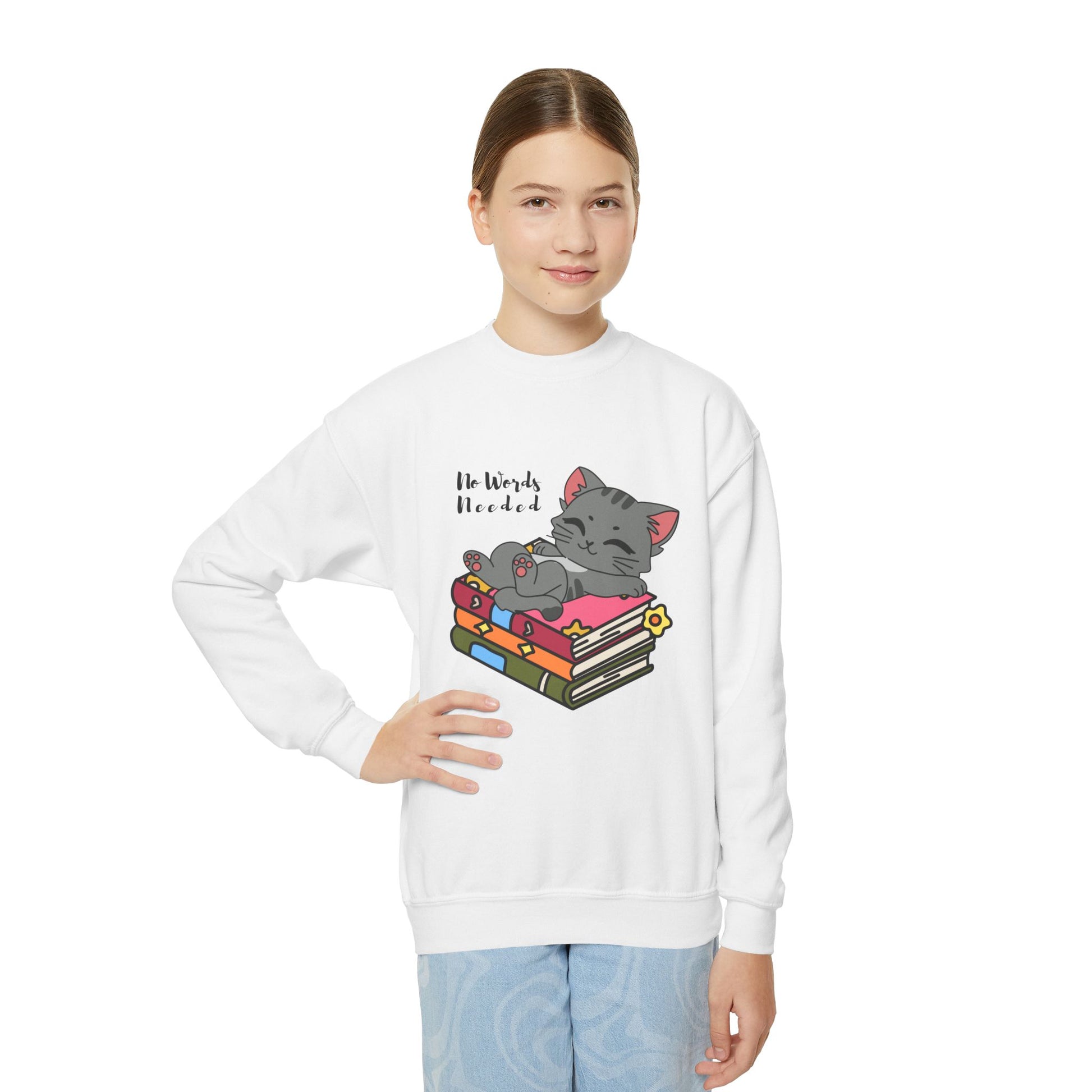 Girl wearing a white sweatshirt with a cat lounging on a stack of books and 'No Words Needed' text 
