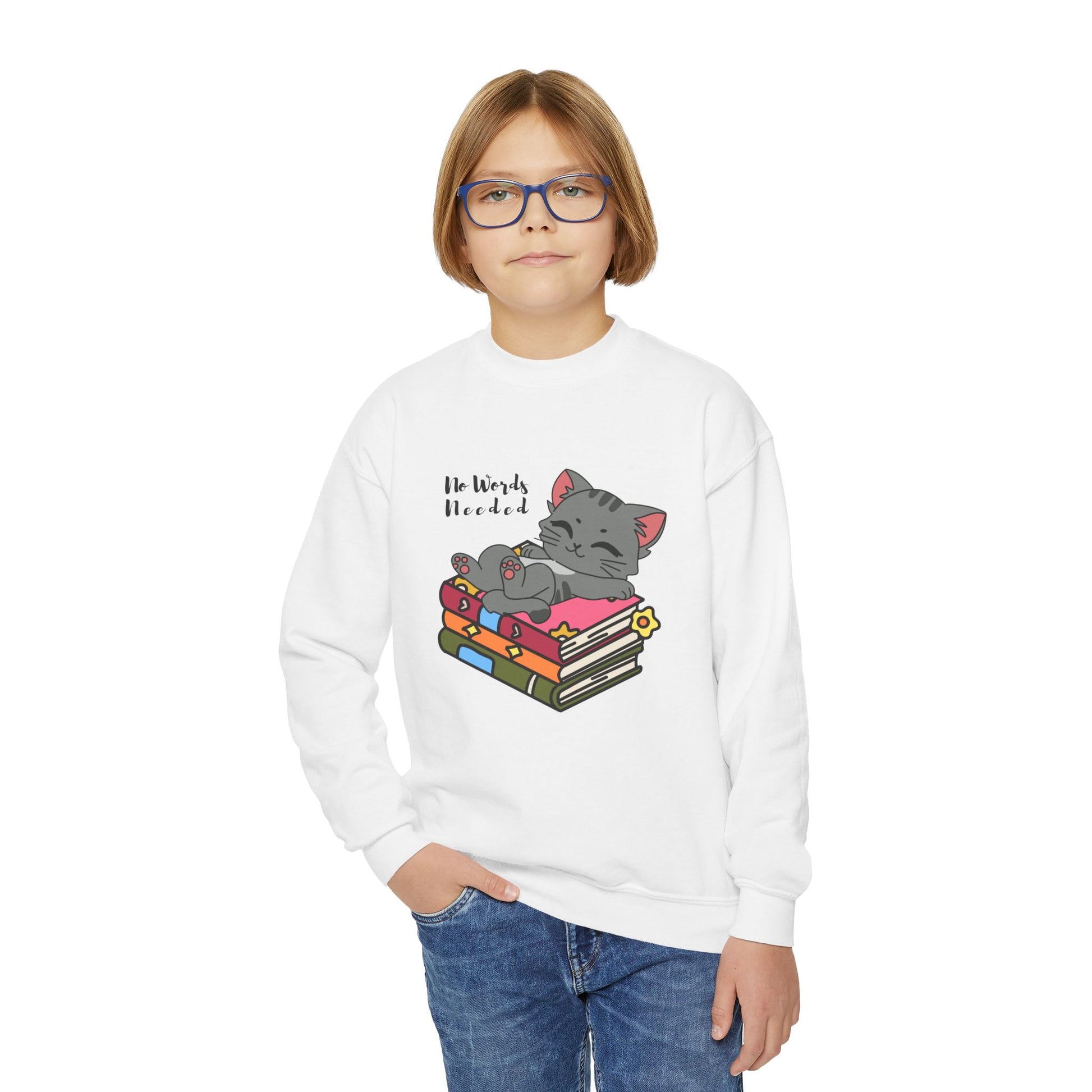 Boy wearing a white sweatshirt with a cat lounging on a stack of books and 'No Words Needed' text 