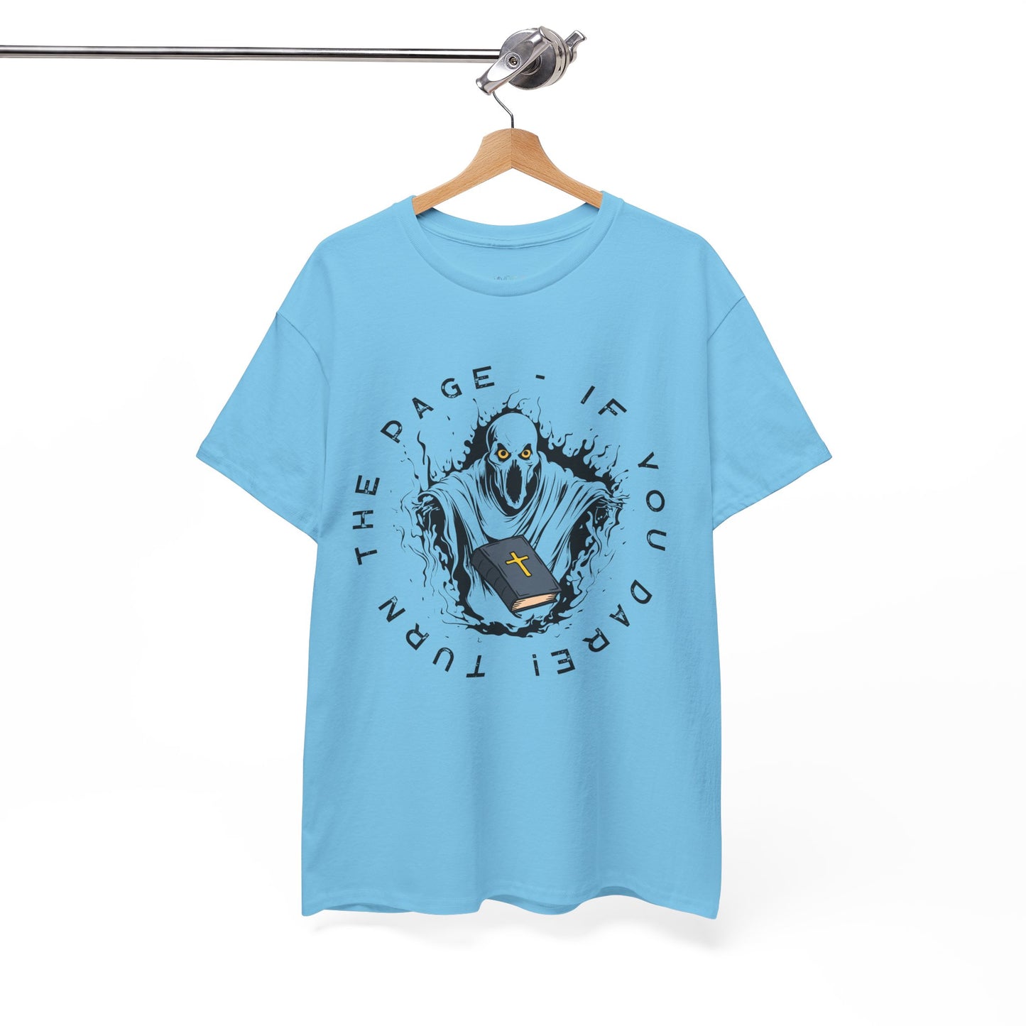 Blue t-shirt with graphic design of a spirit with a religious book and text 'Turn The Page - If You Dare!' 