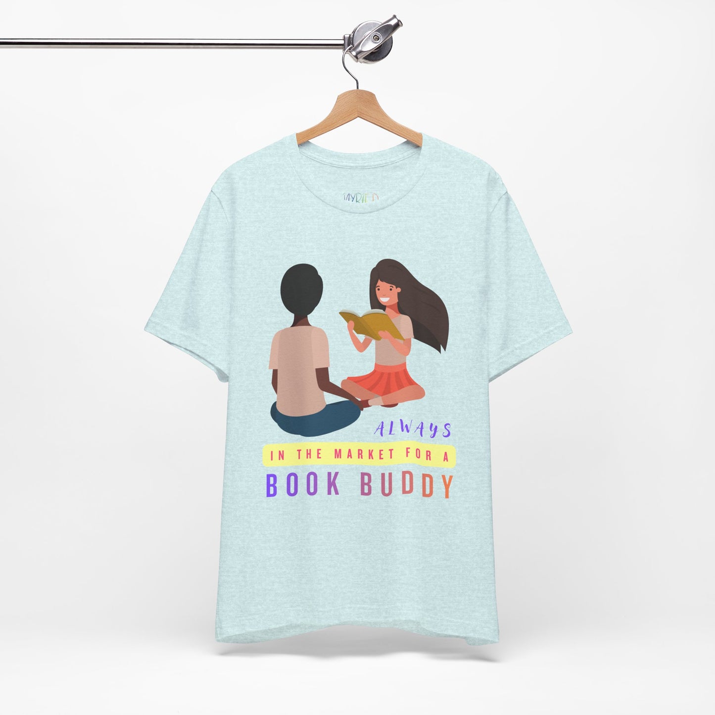 Light blue t-shirt with graphic of two people reading together and text 'Always in the market for a book buddy' 