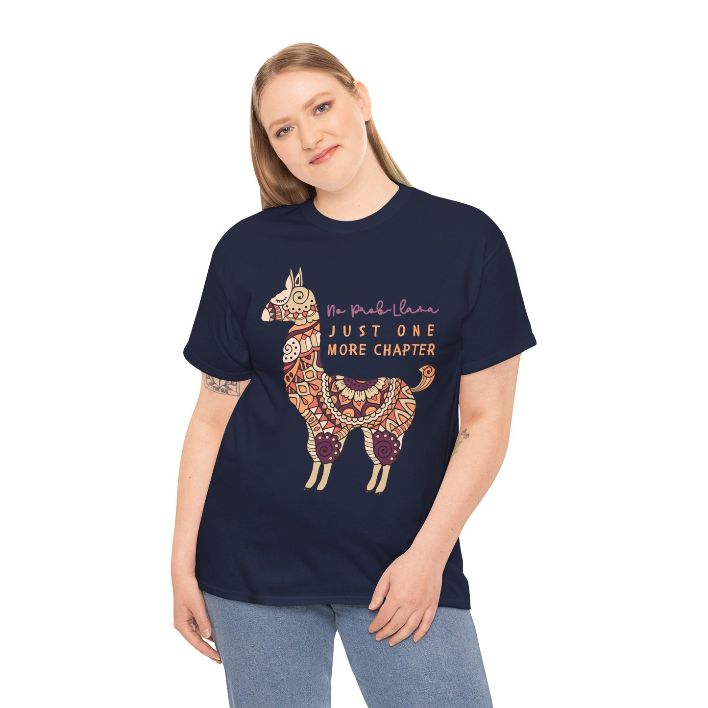 Woman wearing a navy blue t-shirt with a decorative llama graphic and text 'No Prob Llama, Just One More Chapter'