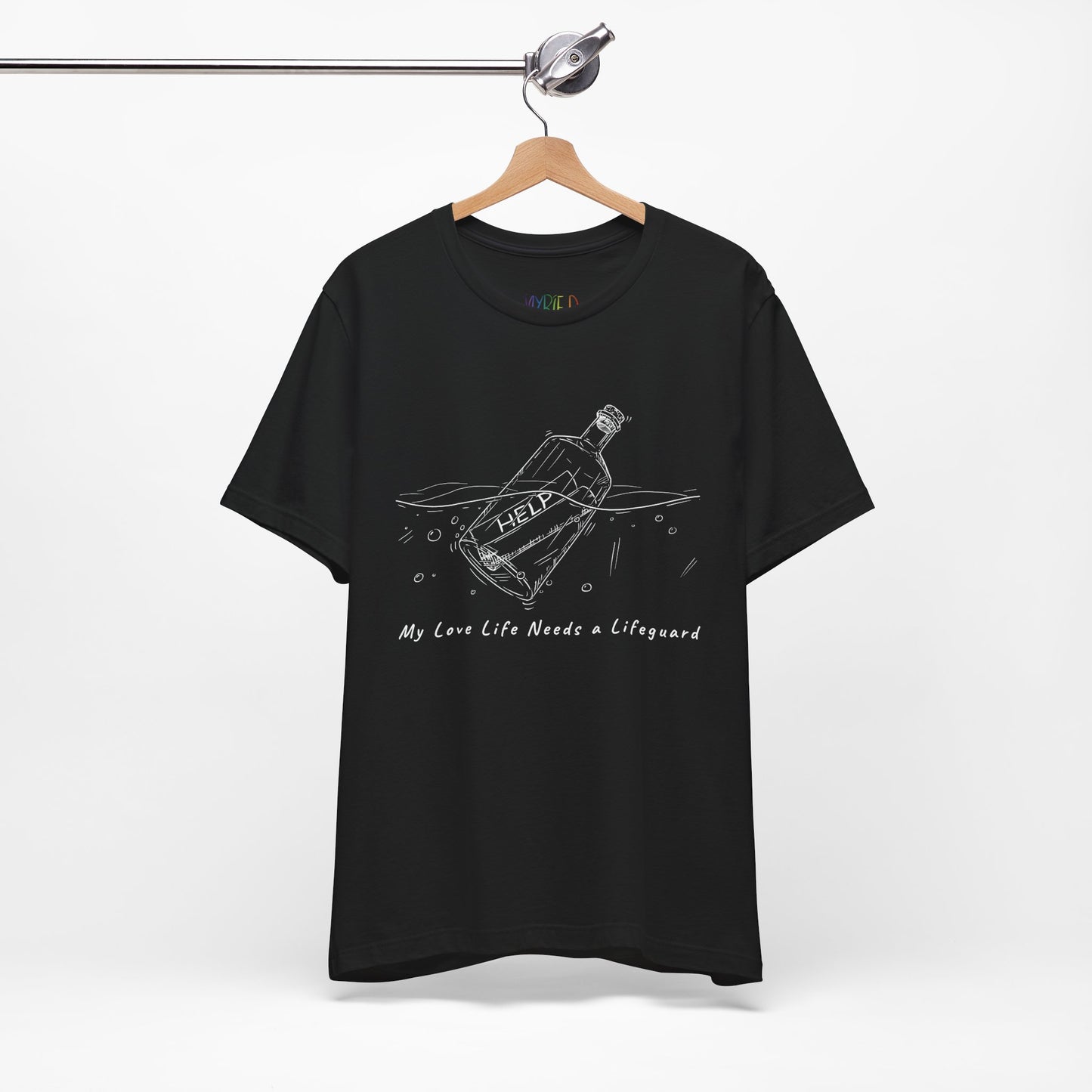 Black t-shirt with white sketched image of a bottle floating in water with a rolled up paper inside that says 'help' and text below 'My Love Life Needs a Lifeguard'