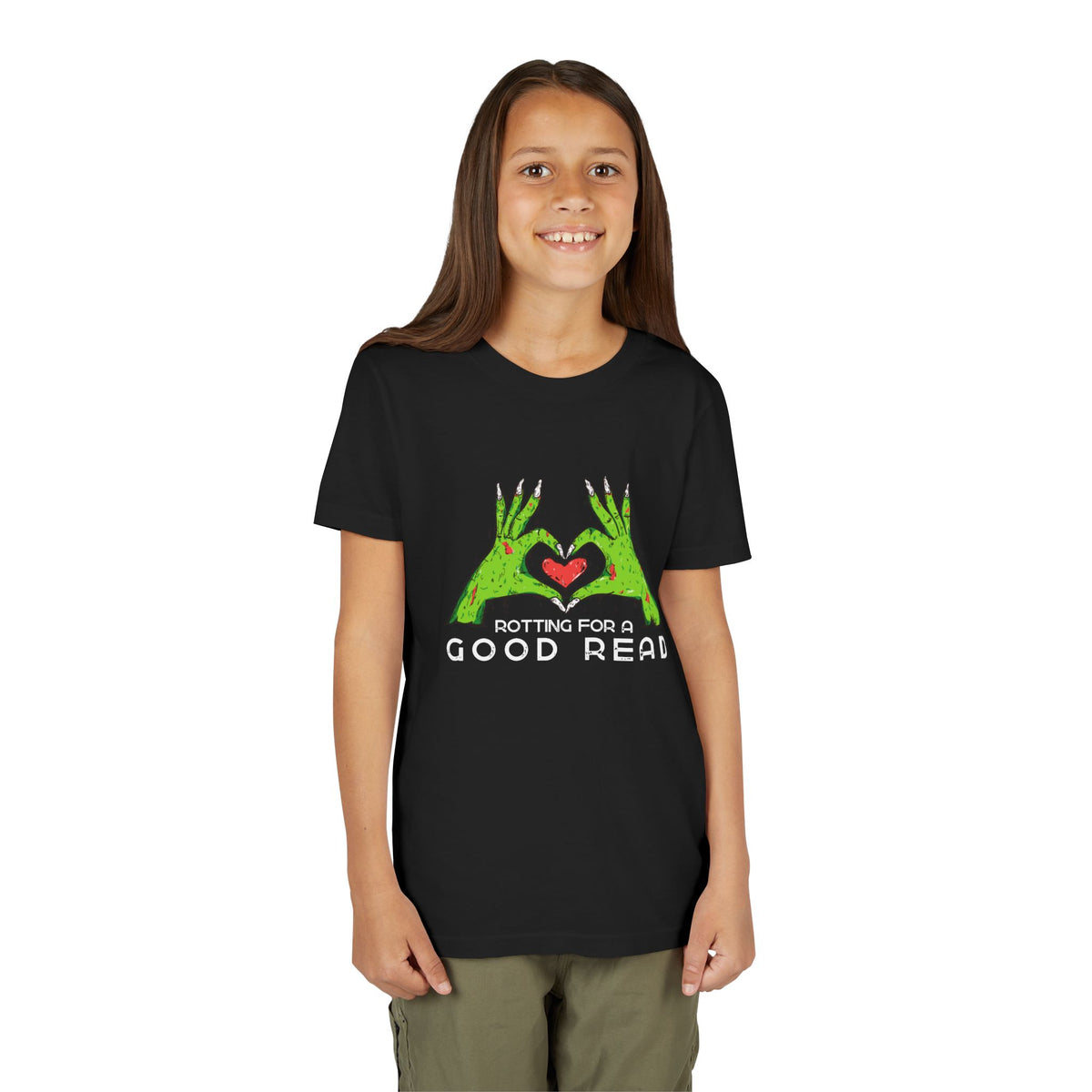 Girl wearing a black t-shirt with two zombie hands holding a heart and text "rotting for a good read"