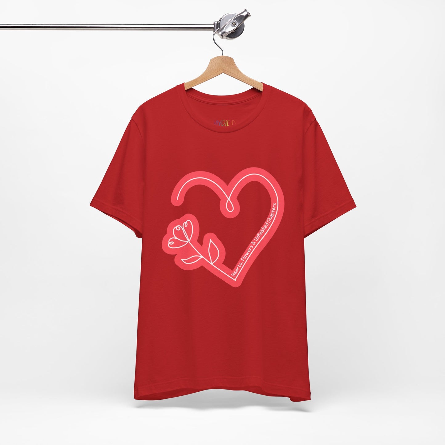 Red t-shirt with a light red heart and flower sketched design and text 'Hearts, Flowers & Unfinished Chapters'