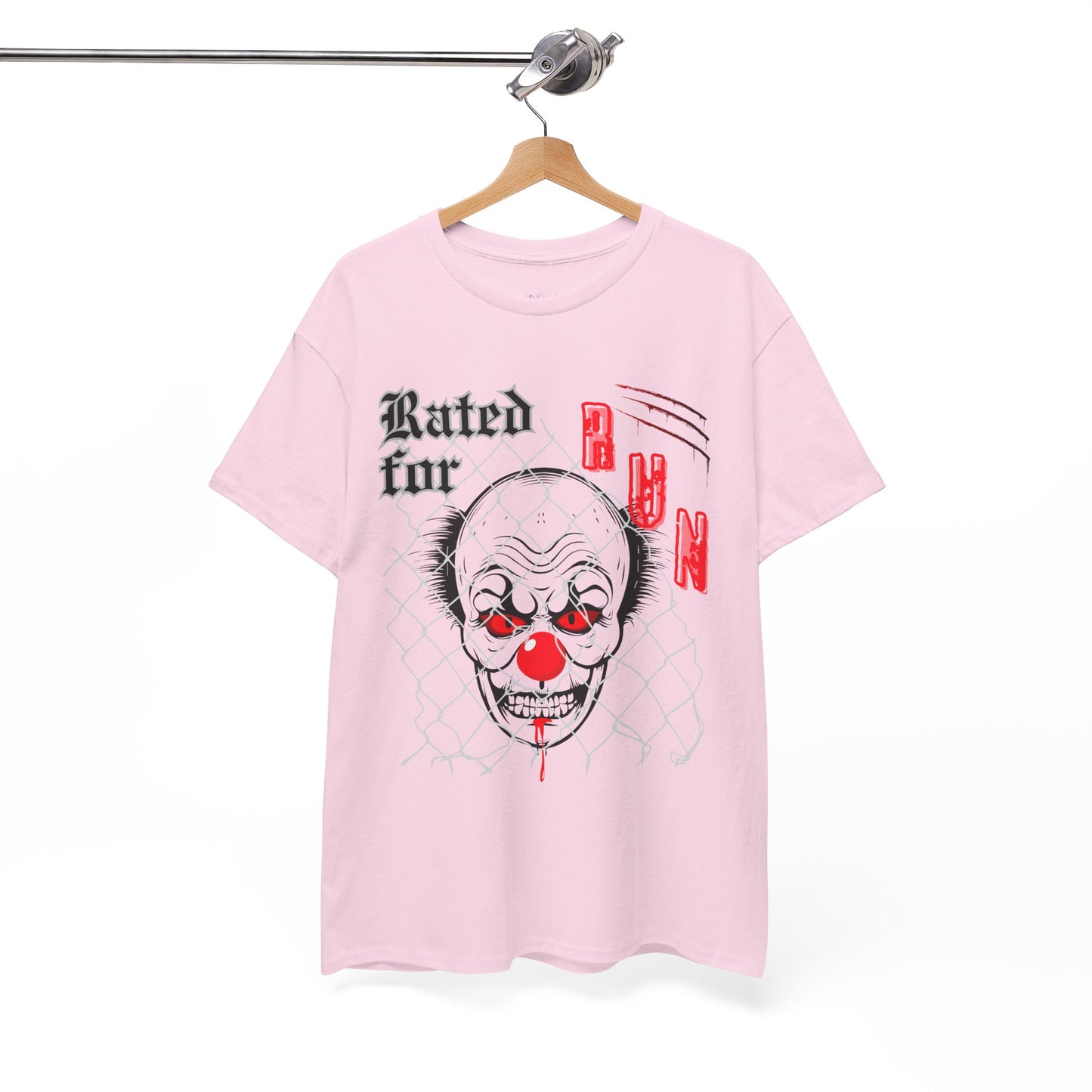 Pink horror t-shirt with a graphic design of a scary clown face behind chain linked fence and text 'Rated for R' on a hanger against a white background