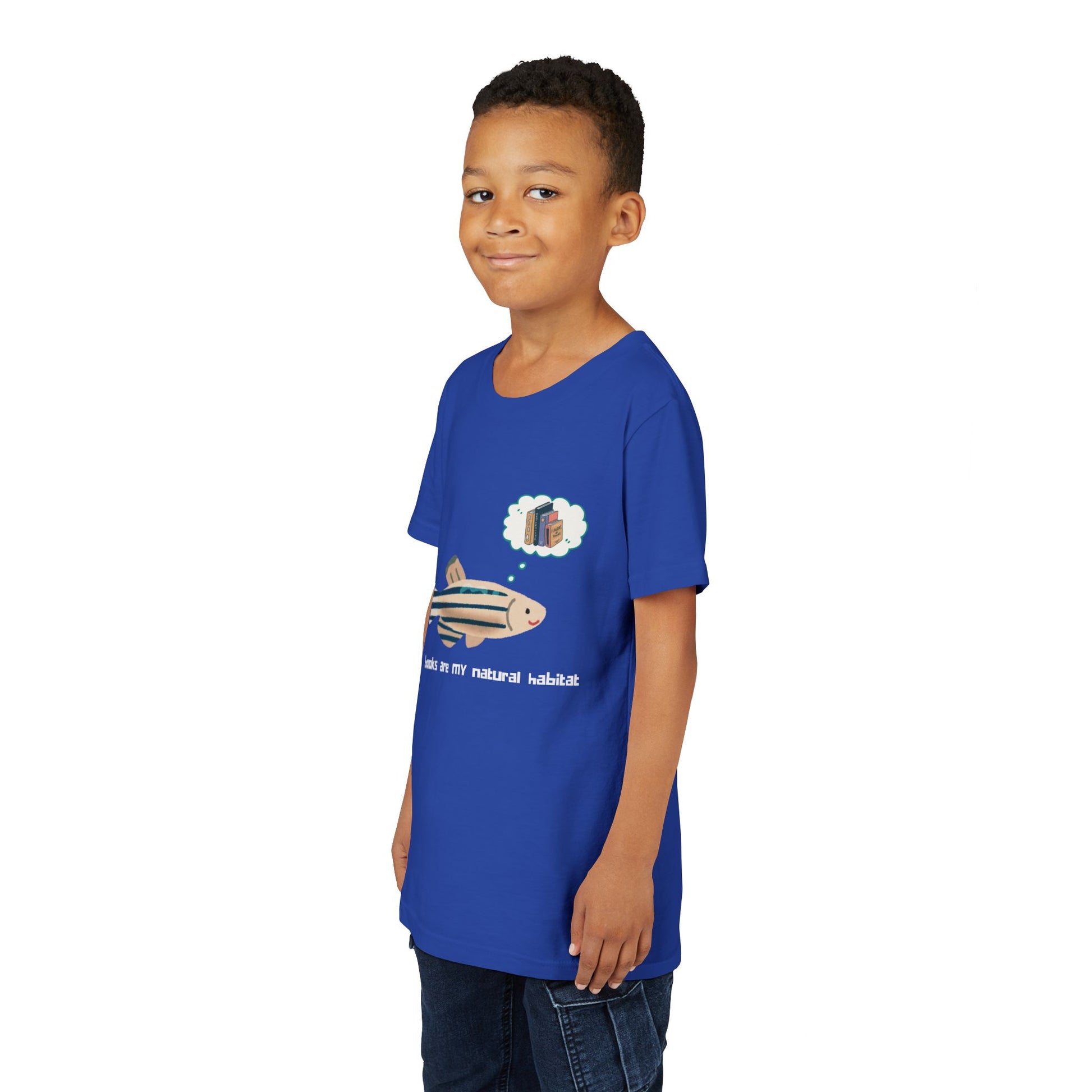 Boy wering a blue t-shirt with a fish graphic, thought bubble of books and text 'books are my natural habitat'