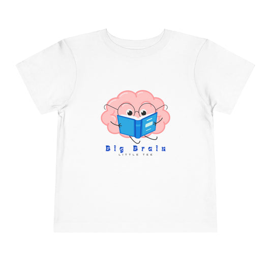 White toddler t-shirt with a cartoon brain design reading a book and 'Big Brain, Little Tee' text 