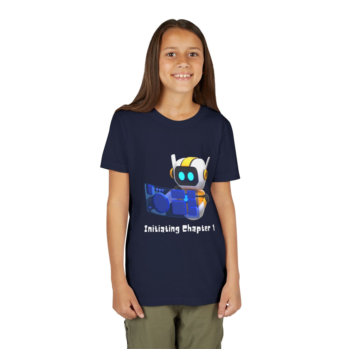 Girl wearing a navy blue t-shirt with a robot graphic, computer and text 'initiating chapter 1'
