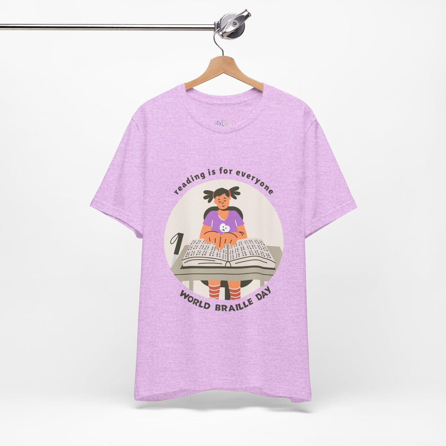 Purple t-shirt with a girl reading a book in braille and text circling that says 'Reading Is For Everyone, World Braille Day' 