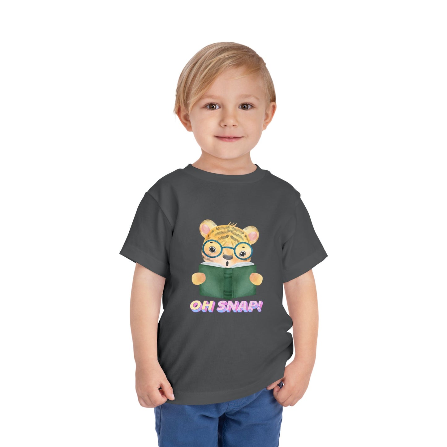 Child wearing a gray toddler t-shirt with a surprised cartoon tiger wearing glasses, holding a book and text 'OH SNAP!' 