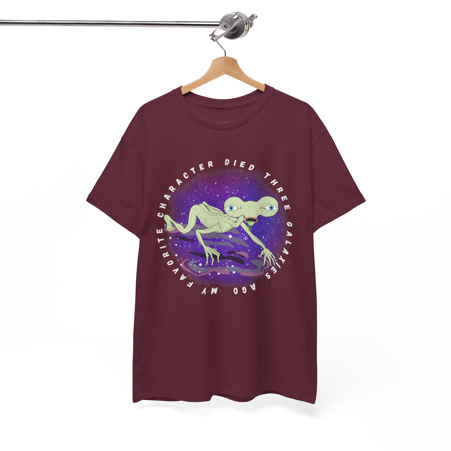 Maroon t-shirt with sickly alien crawling on it's knees and text 'My Favorite Character Died Three Galaxies Ago' 