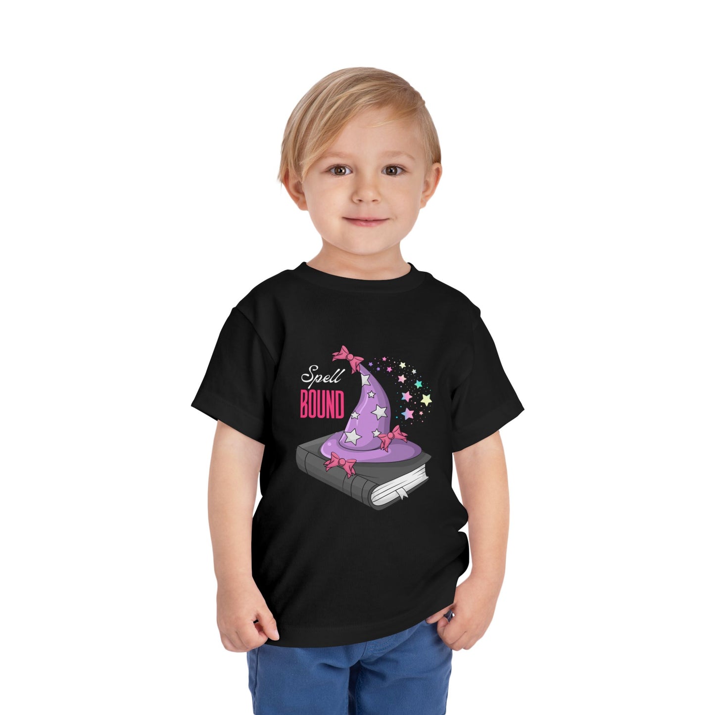 Child wearing a black toddler t-shirt with a wizard hat atop a book and 'Spell Bound' text on a white background