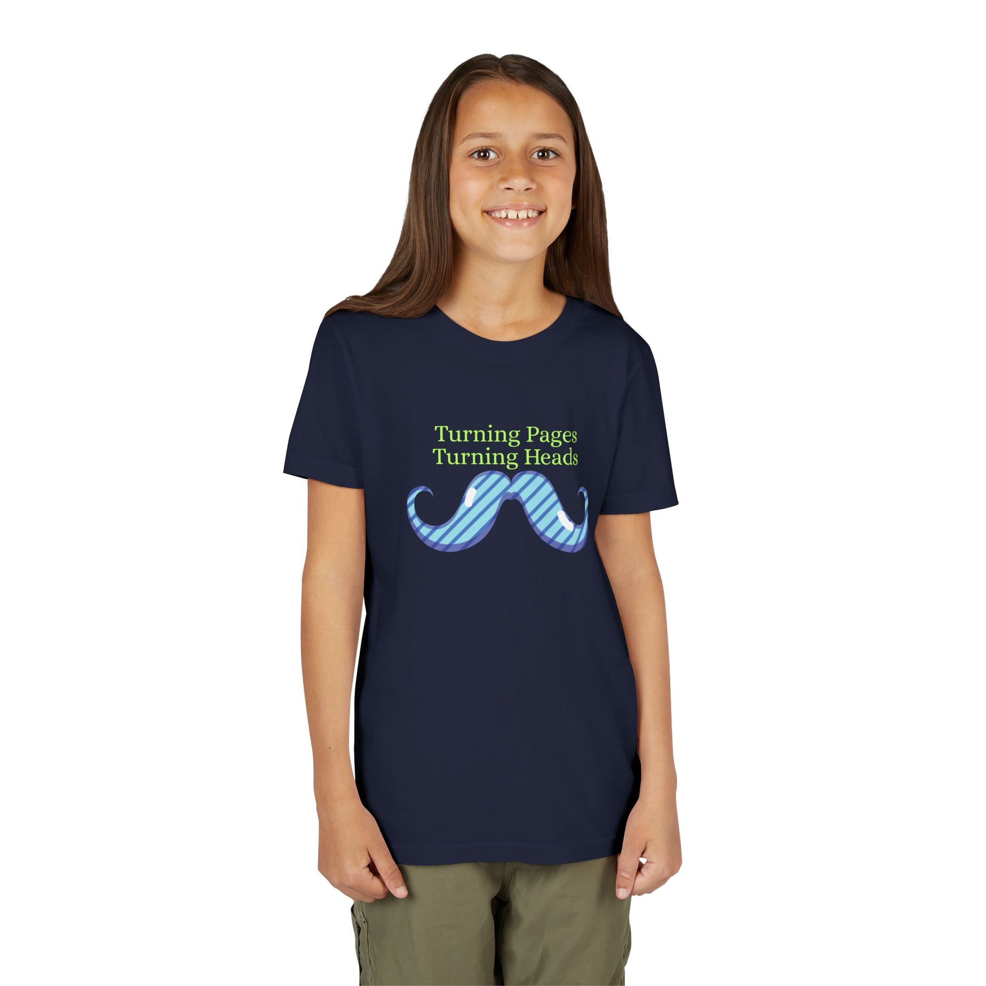 Girl wearing a navy blue t-shirt with a mustache graphic and text 'turning pages turning heads'