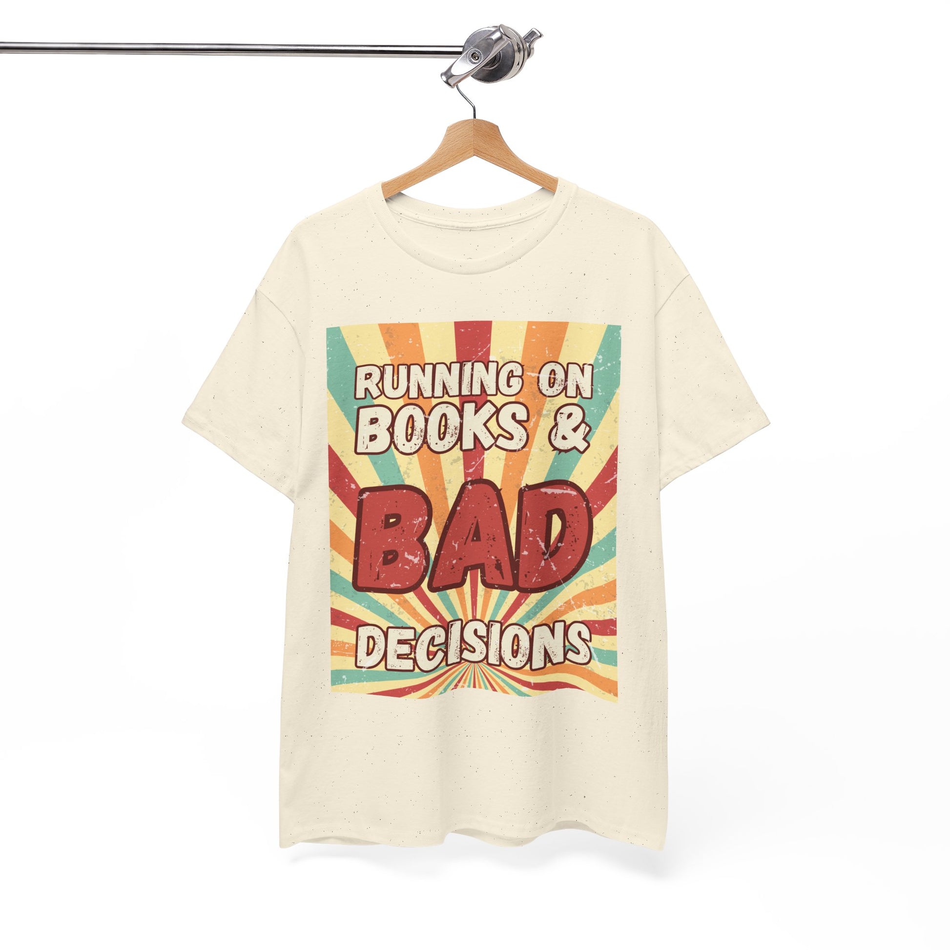 Beige t-shirt with colorful retro burst strip graphic and text 'Running on Books & Bad Decisions' 
