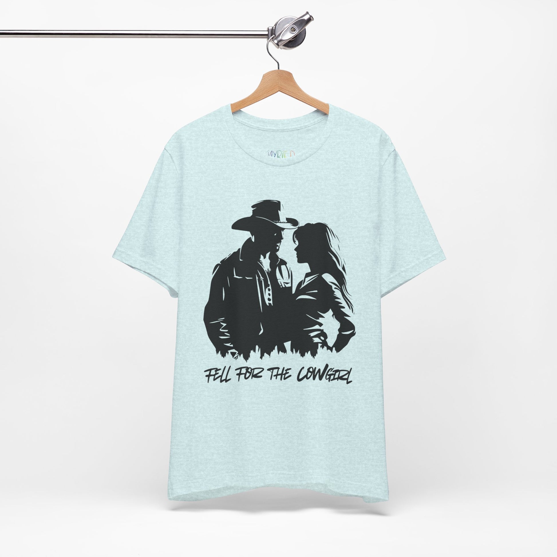 Light blue t-shirt with black graphic of a man and a woman, text says 'Fell for the Cowgirl'