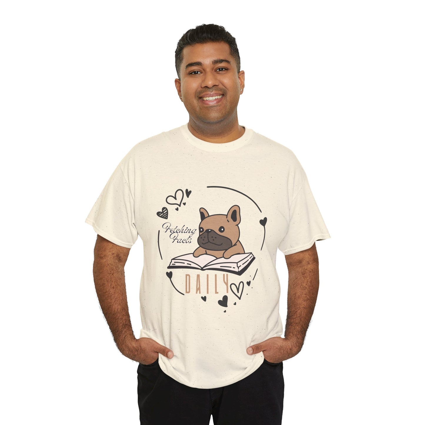 Man wearing a beige t-shirt with a dog graphic reading a book and text 'Fetching Facts Daily, circled with hearts 