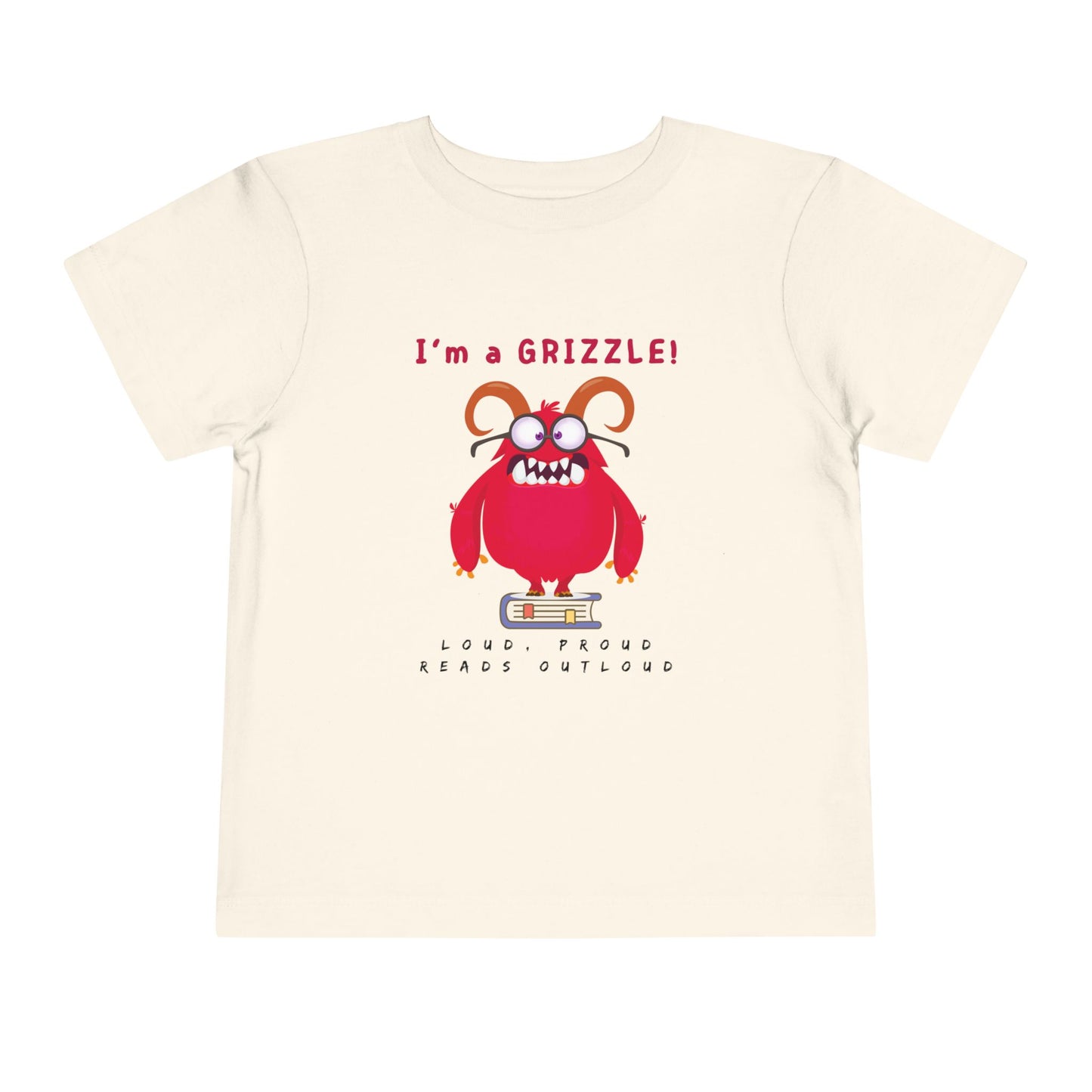 Beige toddler personality t-shirt with a red monster graphic standing on a book proudly proclaiming 'I'm a GRIZZLE!' Sub-text 'Loud, Proud, Reads Aloud.'