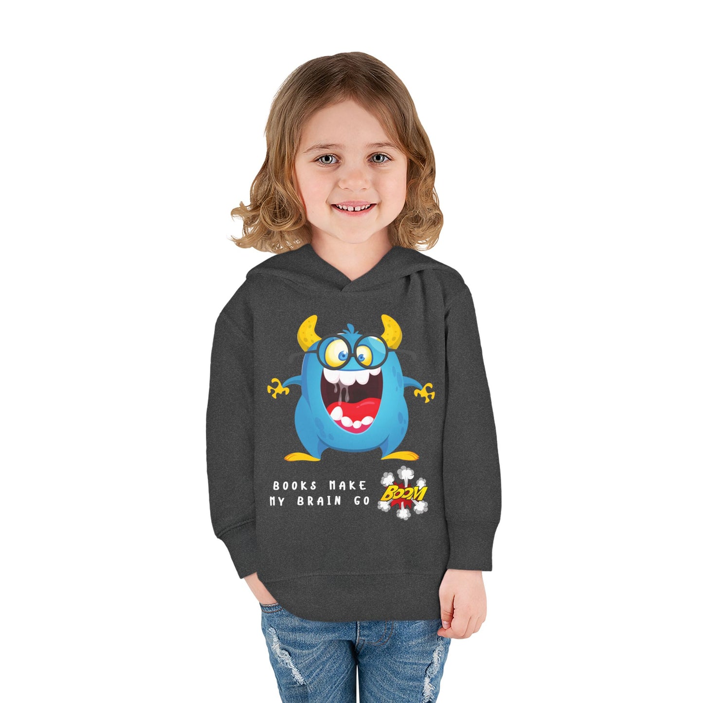 Girl wearing a dark gray hoodie with a blue and yellow cartoon monster, text 'books make my brain go boom'