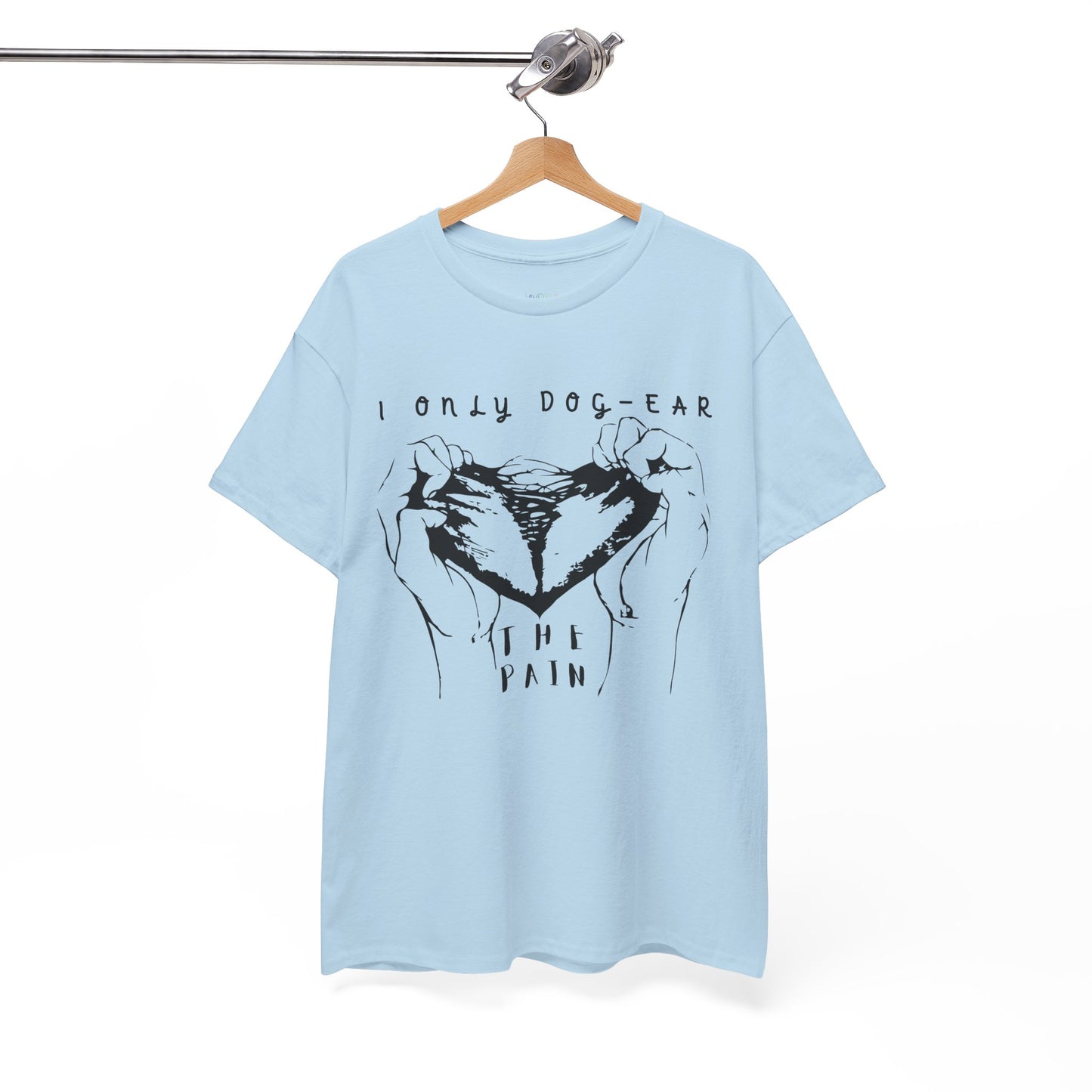 Light blue t-shirt with black graphic of hands tearing apart a heart and text 'I Only Dog-Ear The Pain'