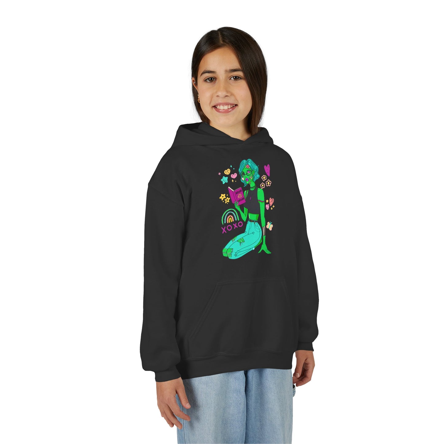 Girl wearing a black hoodie with a colorful reading zombie surrounded by doodles