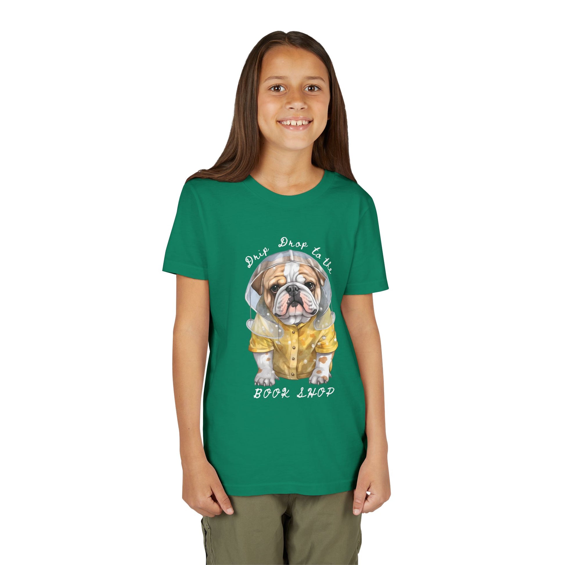 Girl wearing a green t-shirt with a bull dog in a rain coat and text 'Drip Drop to the Book Shop'