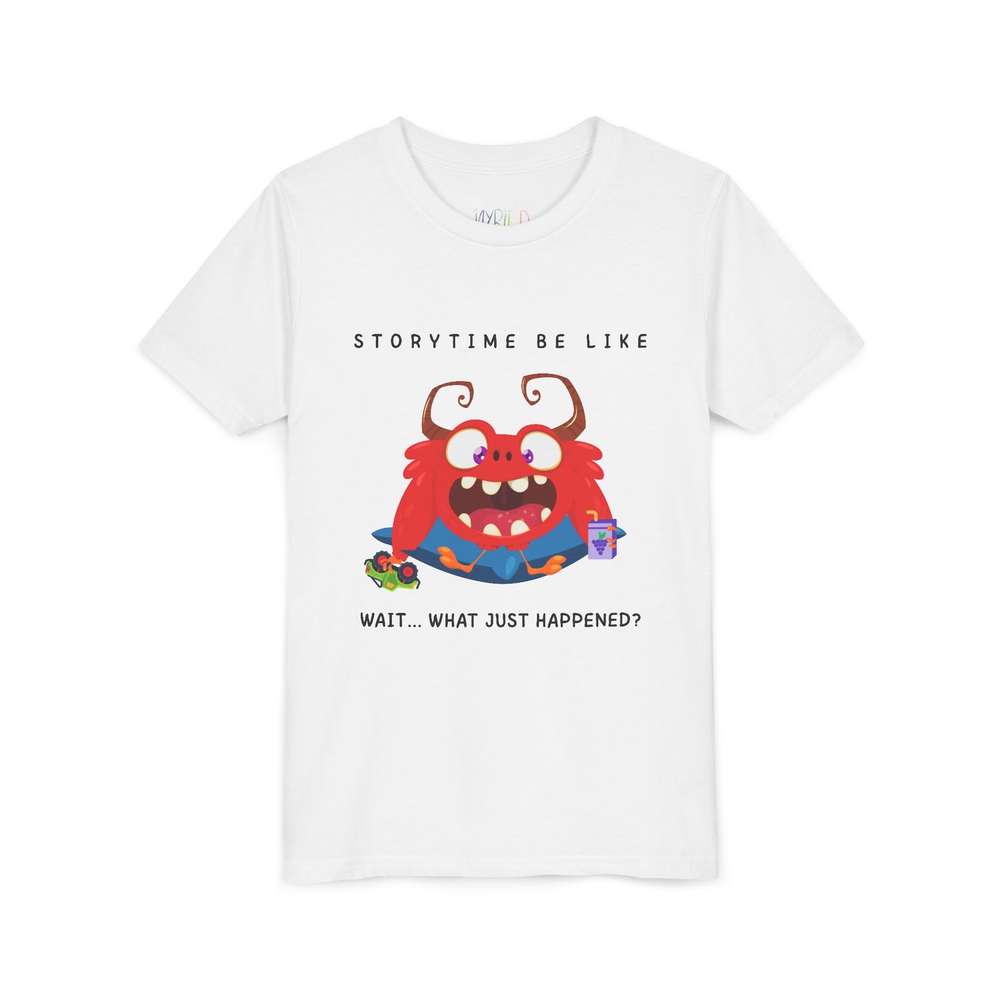 White t-shirt with a bewildered cartoon monster graphic sitting on a pillow, holding a car toy and a juice box, text 'Storytime be like wait...what just happened?'