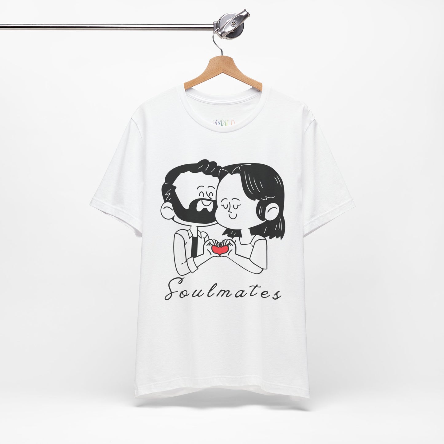 White t-shirt with a graphic of two people snuggled, making a heart shape by putting their hands together and text 'Soulmates' 