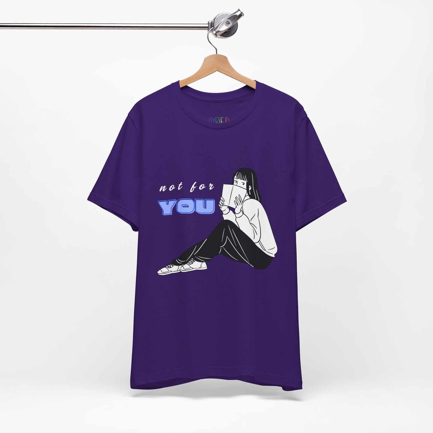 Purple t-shirt with a white and black graphic of a girl peeking out from behind a book, white and blue text 'not for YOU' 