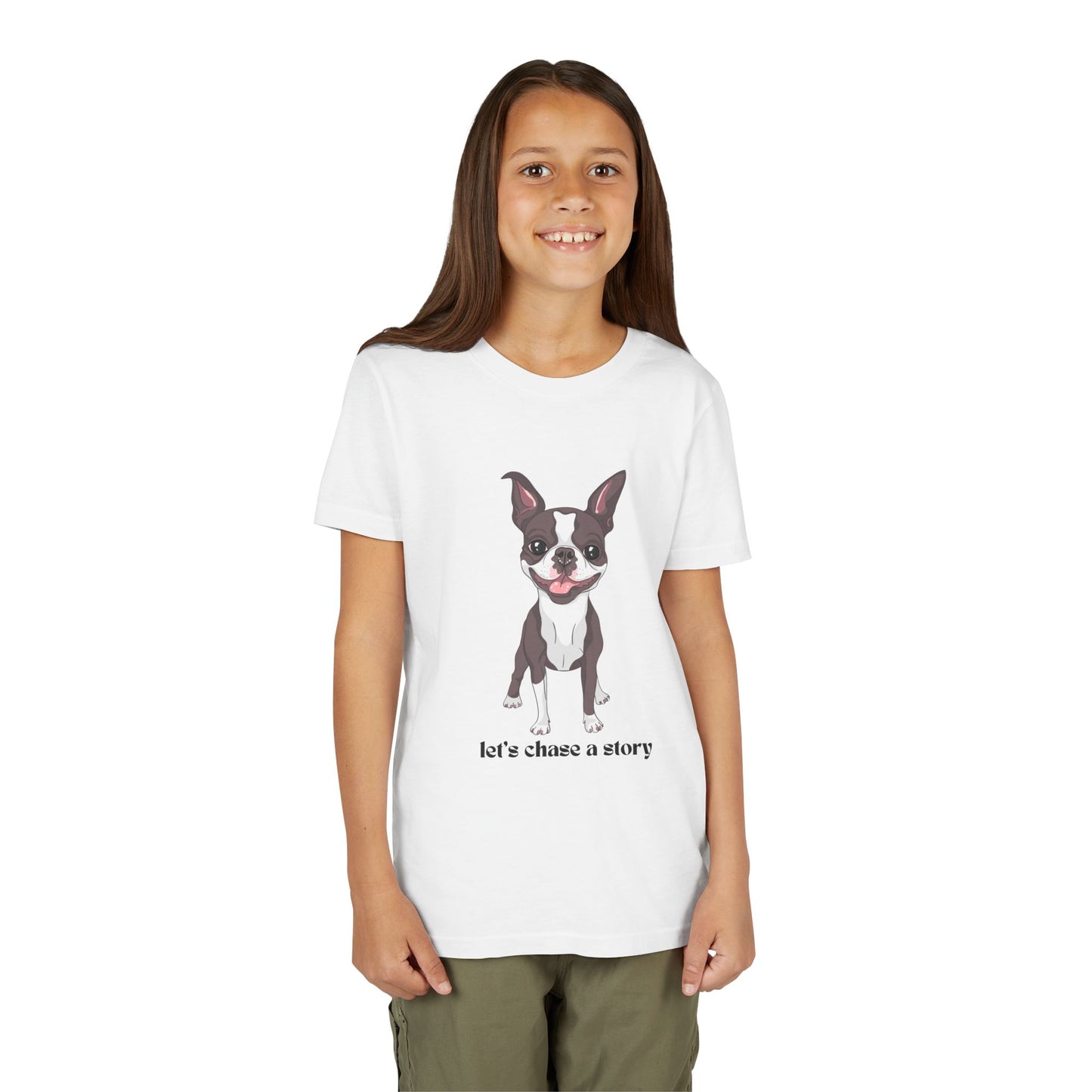 Girl wearing a white t-shirt with a cut dog and text 'let's chase a story'