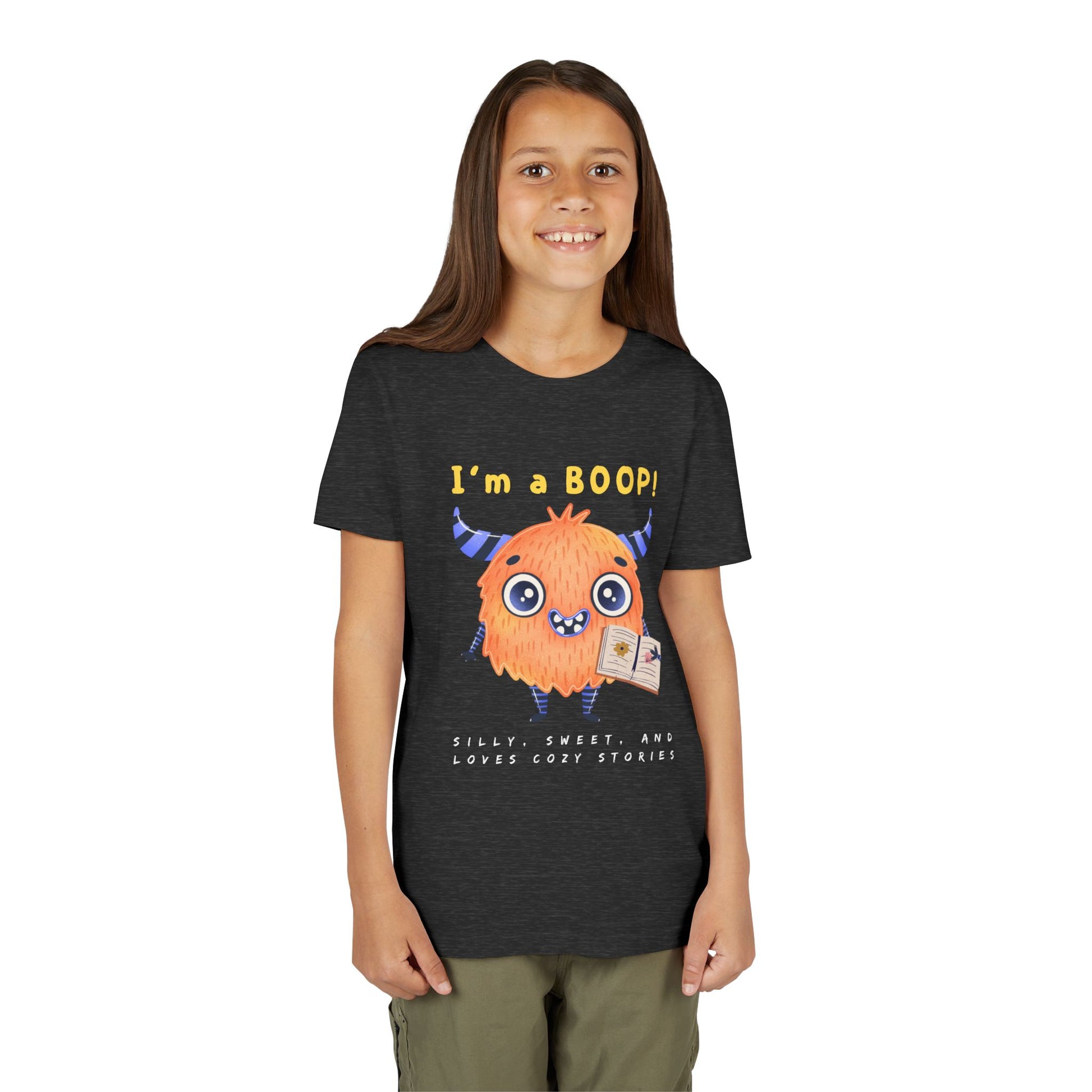 Girl wearing a dark t-shirt with a cartoon monster and text 'I'm a BOOP!'