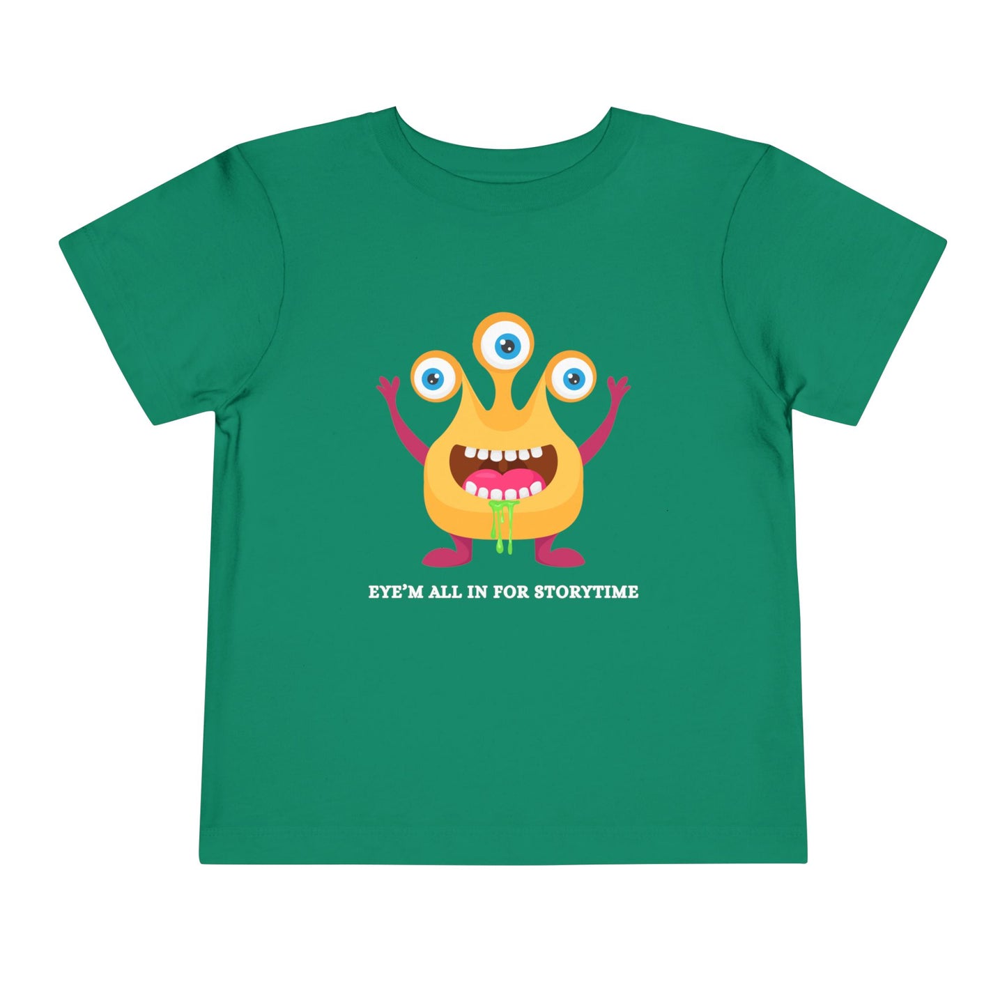 Green toddler t-shirt with a drooling, three-eyed monster graphic and text 'Eye'm all in for storytime' on a white background