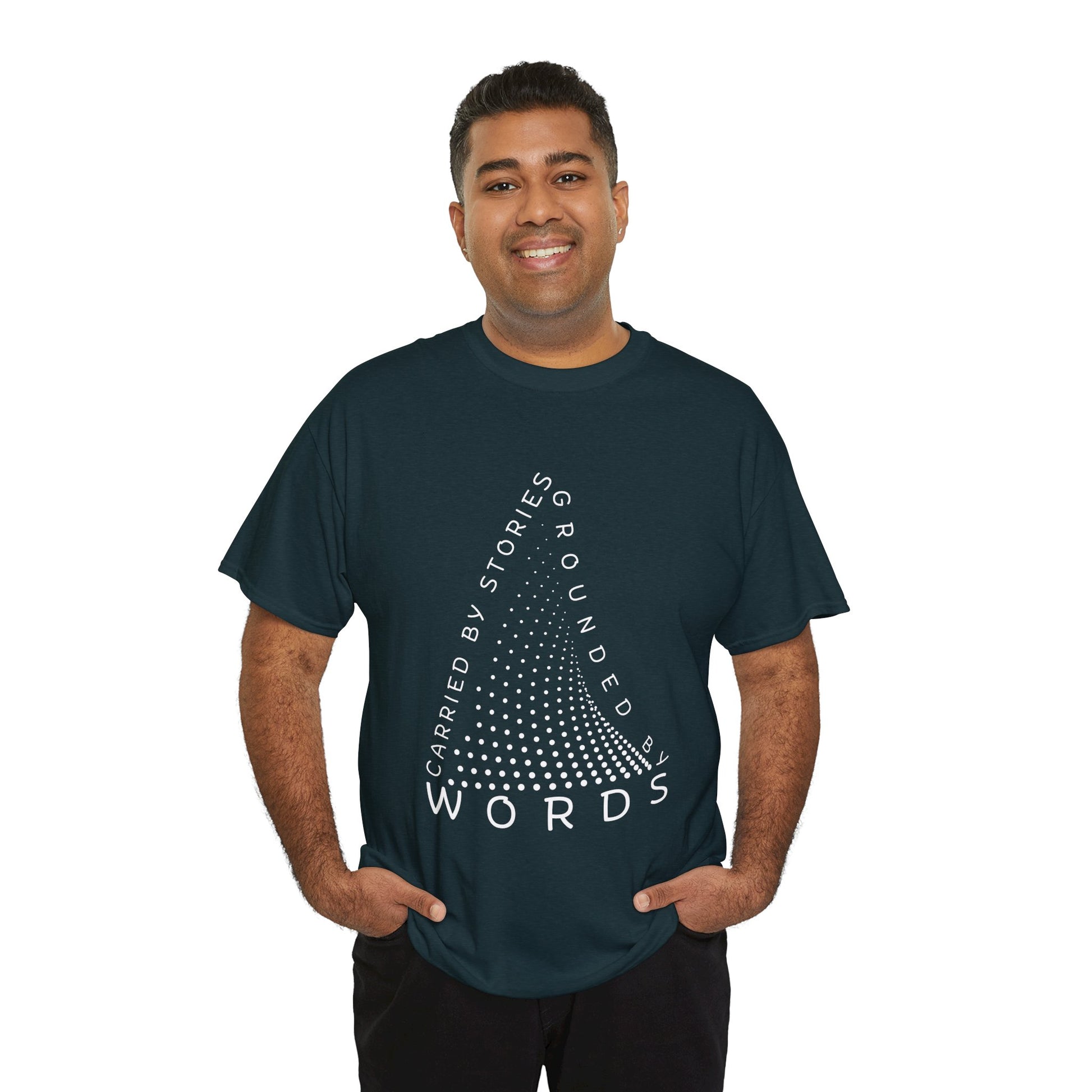 Man wearing a midnight t-shirt with white text that follow the outline of a dotted triangle 'Carried By Stories, Grounded By Words' 