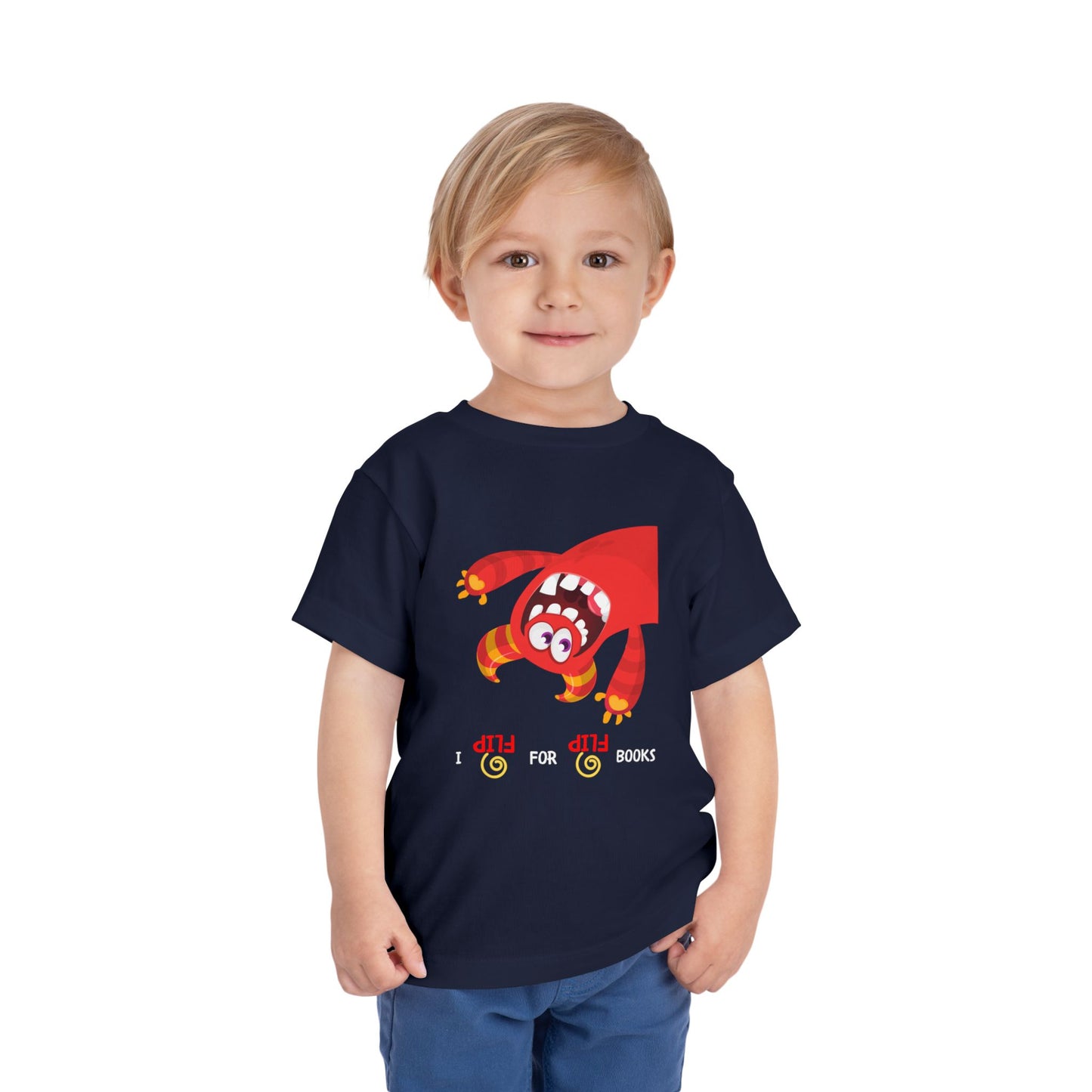 Child wearing a navy toddler t-shirt with an upside down red and orange monster, and playful text 'I FLIP for FLIP Books' 