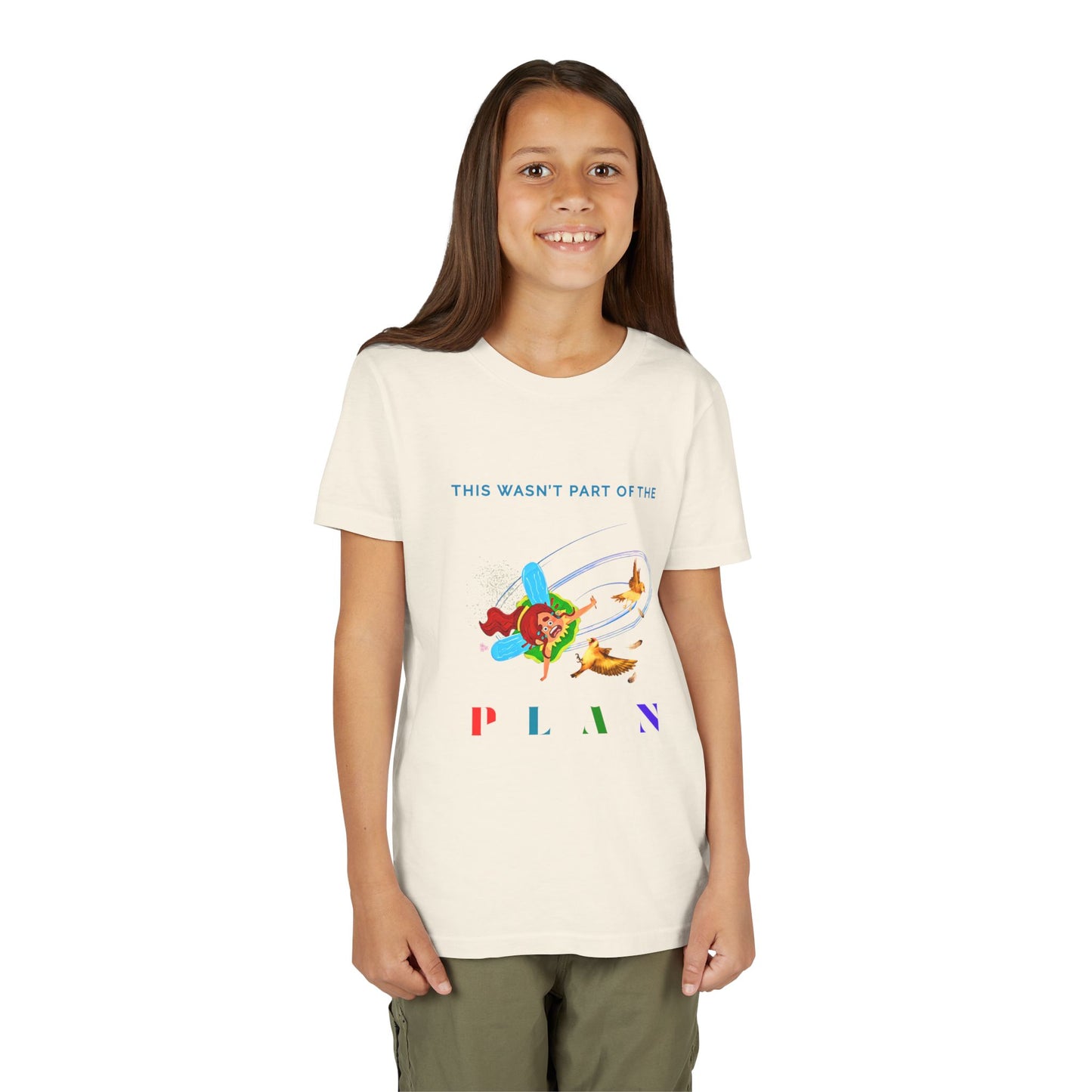 Girl wearing a beige t-shirt with colorful graphic of a fairy crashing into birds mid air and text 'This Wasn't Part Of The PLAN'