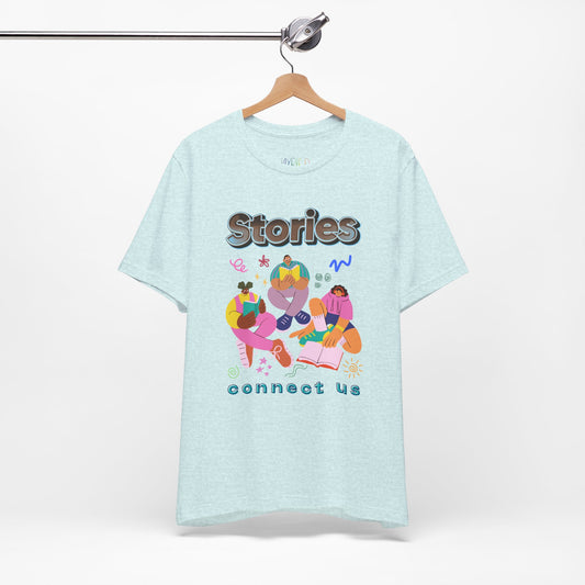 Light ice blue t-shirt with colorful modern people reading, surrounded by doodles, and text 'Stories connect us' 
