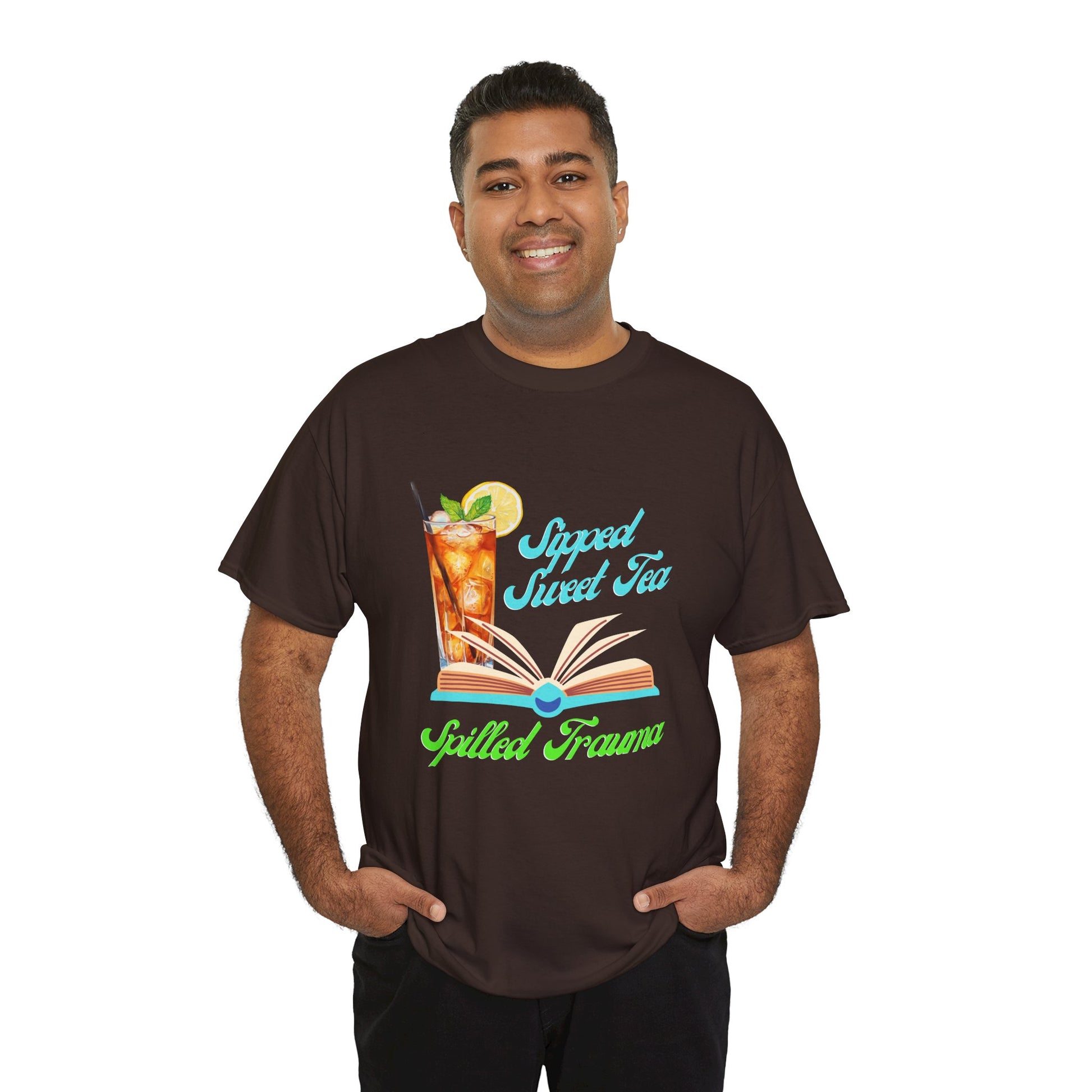 Man wearing a brown t-shirt with a graphic design of a  sweet ice tea, an open book and text 'Sipped Sweet Tea, Spilled Trauma'