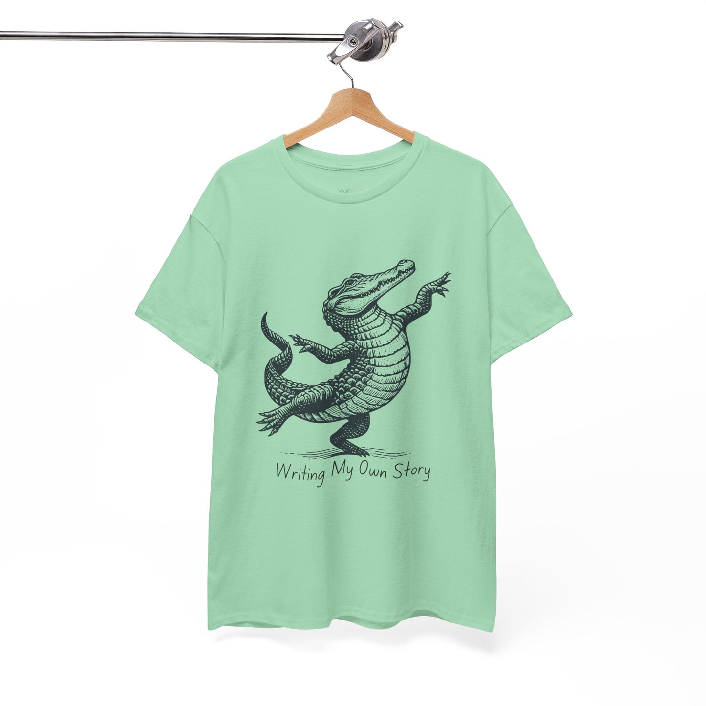 Light green t-shirt with dancing alligator graphic and text 'Writing My Own Story' 