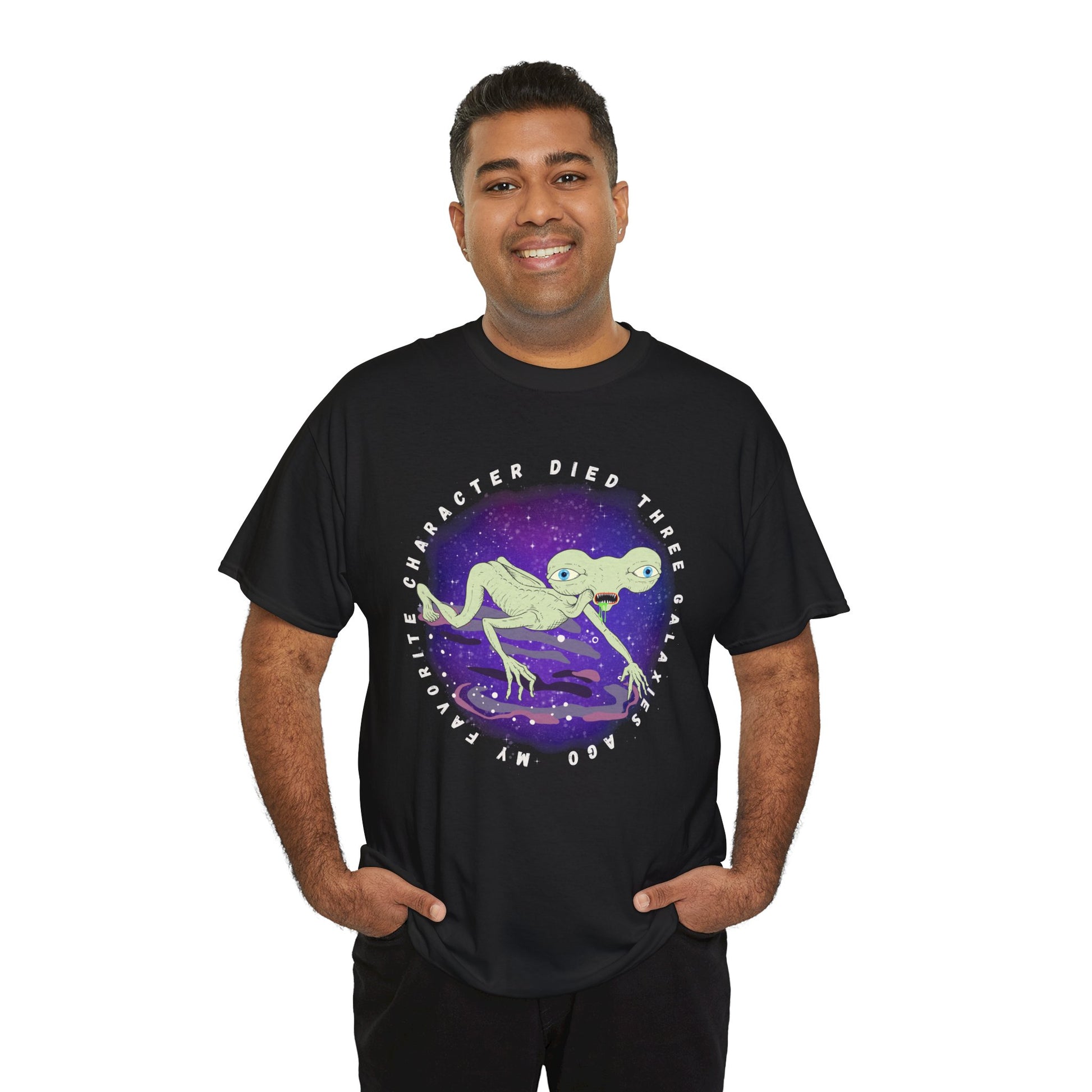 Man waring a black t-shirt with sickly alien crawling on it's knees and text 'My Favorite Character Died Three Galaxies Ago' 