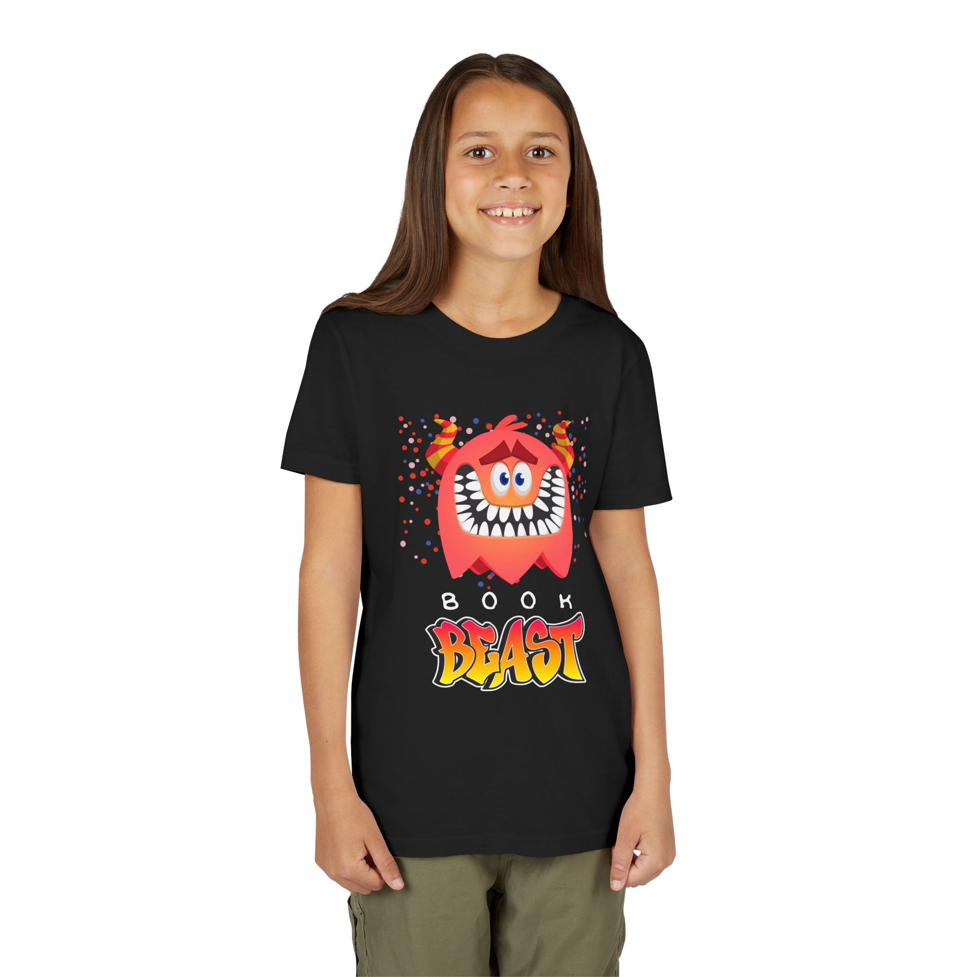 Girl wearing a black t-shirt with a sheepish, toothy, red monster surrounded by confetti and text 'BOOK BEAST' 