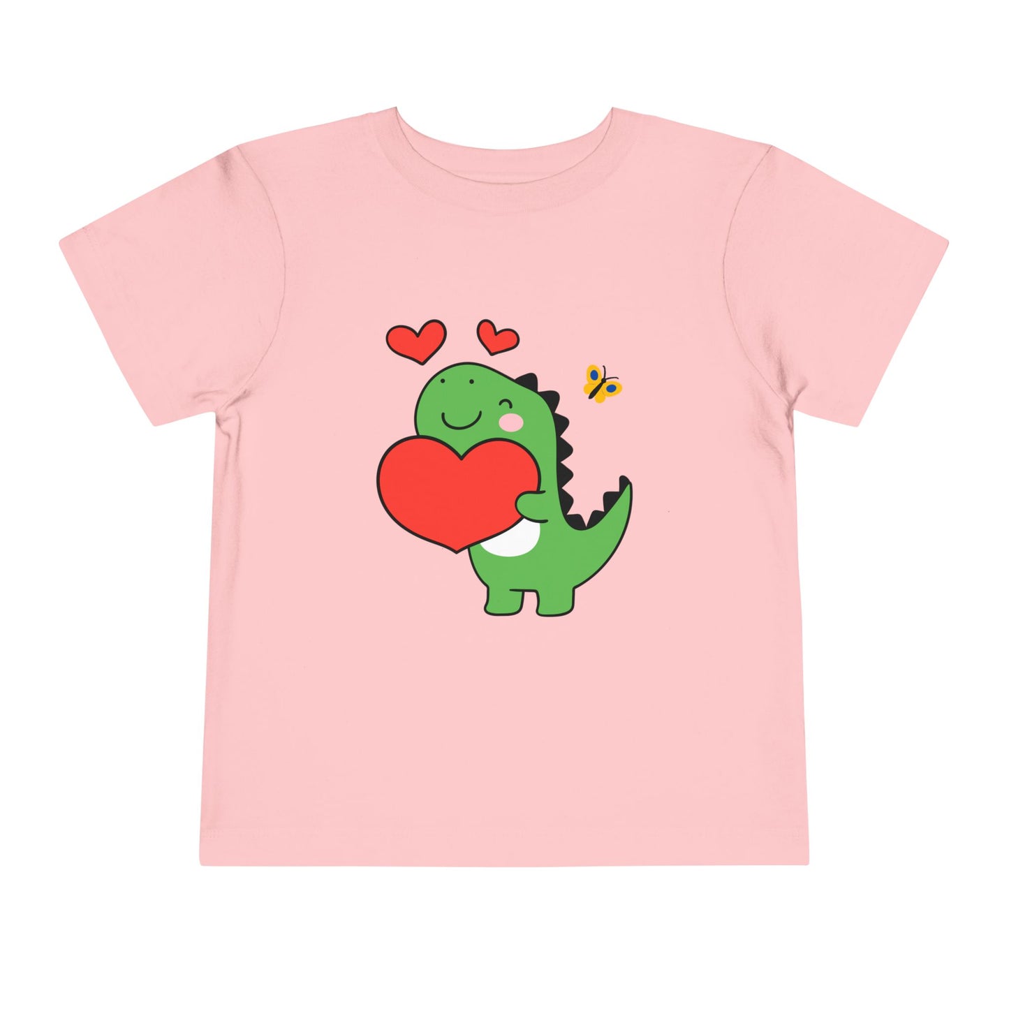 Pink toddler t-shirt with a cartoon dinosaur hugging a red heart