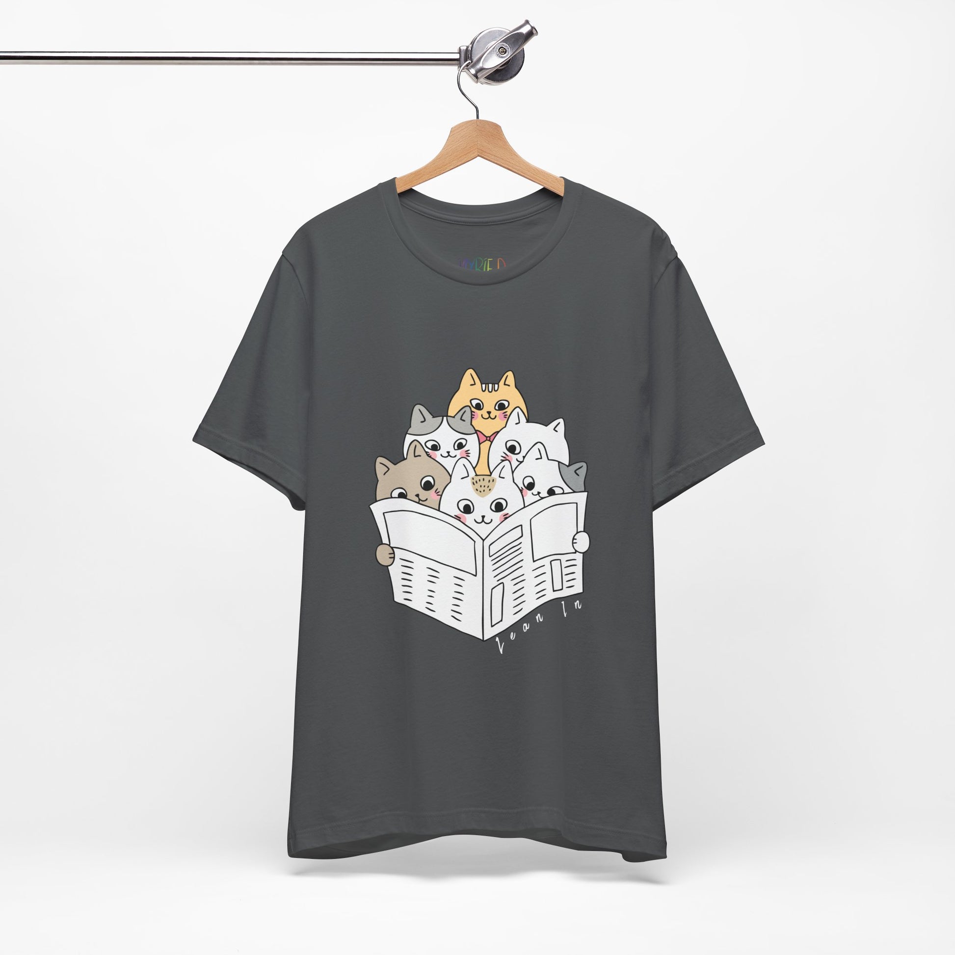 Gray t-shirt with cartoon cats squeezed in to read the newspaper and text 'Lean In'