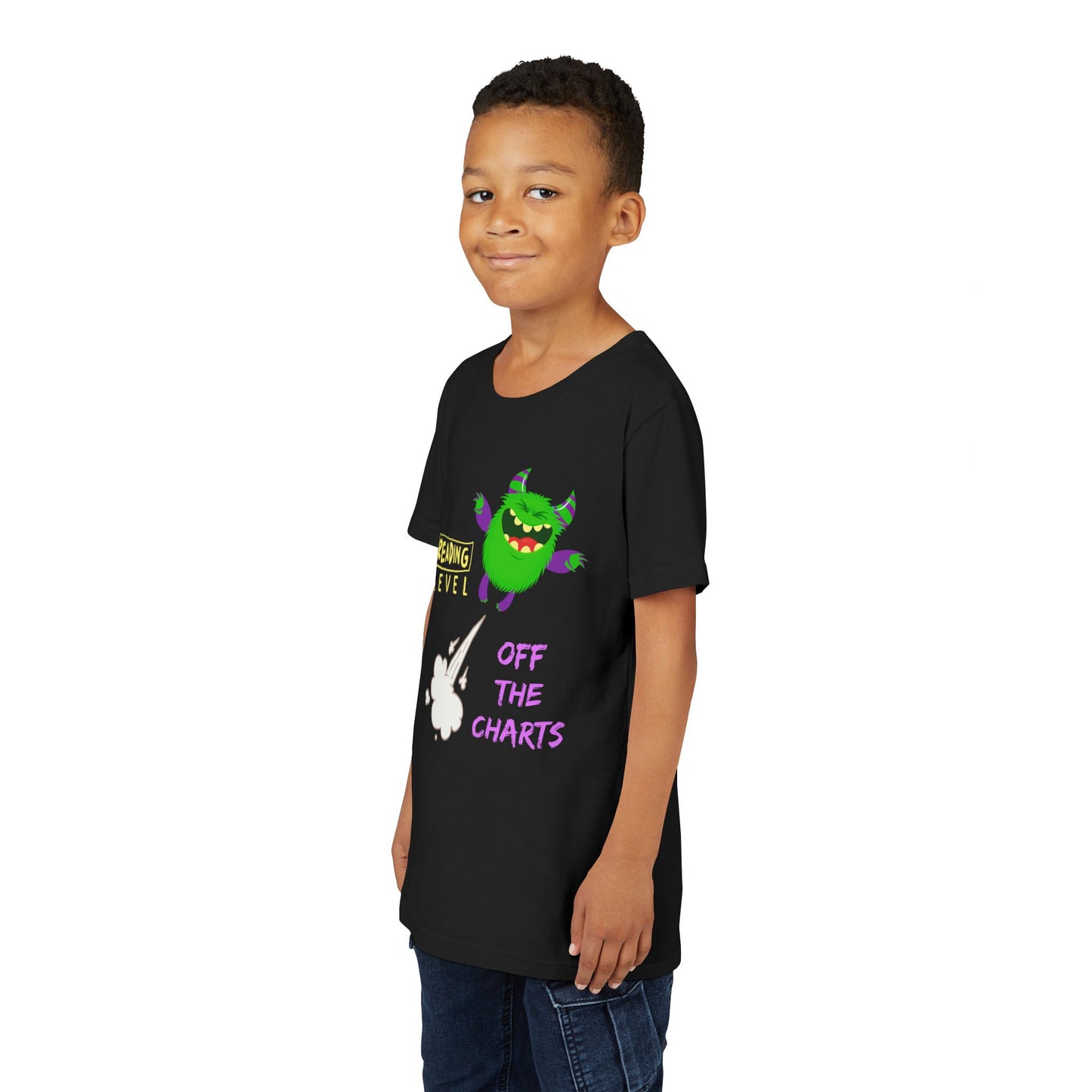 Boy wearing a black t-shirt with a green monster blasting off and text 'Reading Level Off The Charts'