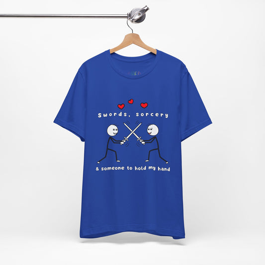 Blue t-shirt with graphic design of two smiling stick figures sword fighting and text 'Swords, Sorcery & Someone To Hold My Hand'