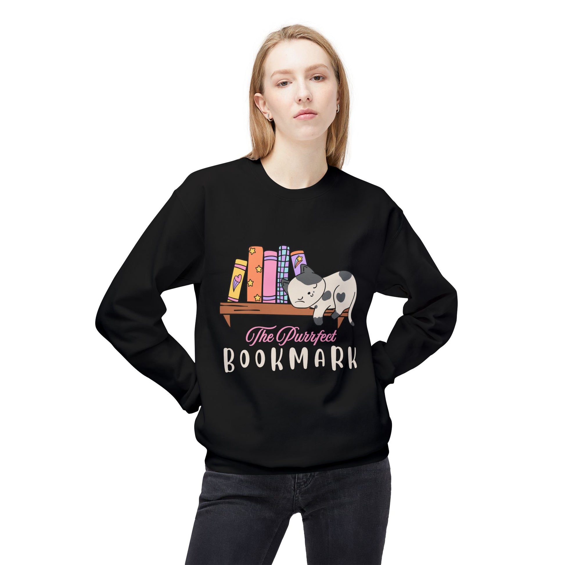 Woman wearing a black sweatshirt with a cat sleeping on a bookshelf and 'The Purrfect Bookmark' text 