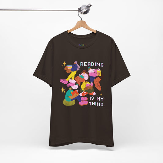 Black t-shirt with colorful modern people reading books and 'Reading is my thing' text 