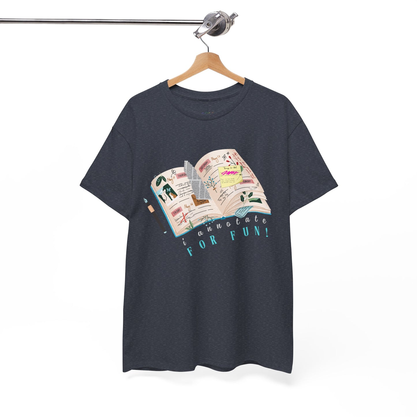 Heather navy t-shirt with a An open scrapbook full of scribbles, tickets, newspaper clippings and more, text 'I Annotate For Fun' 