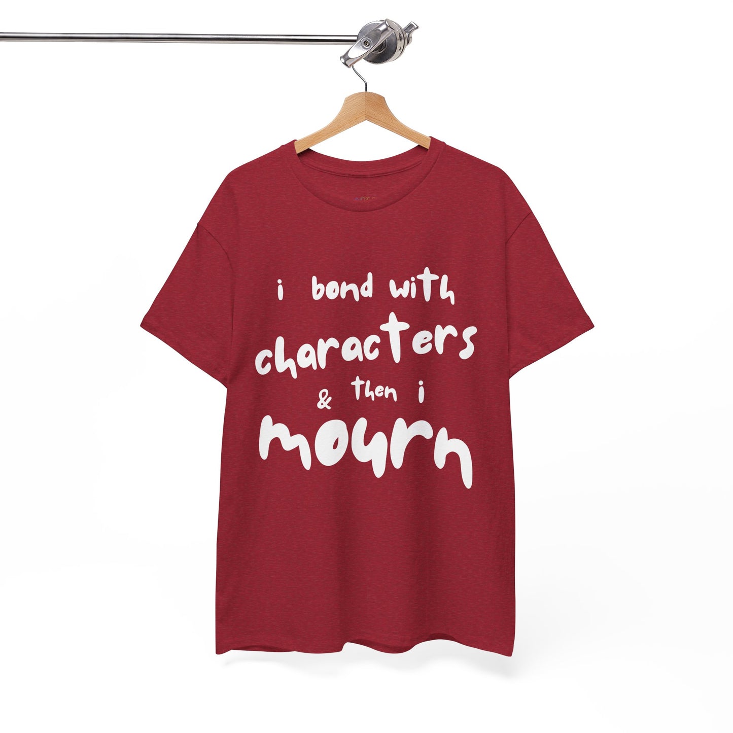 Red t-shirt with exaggerated sized letters and text 'I Bond With Characters & Then I Mourn'