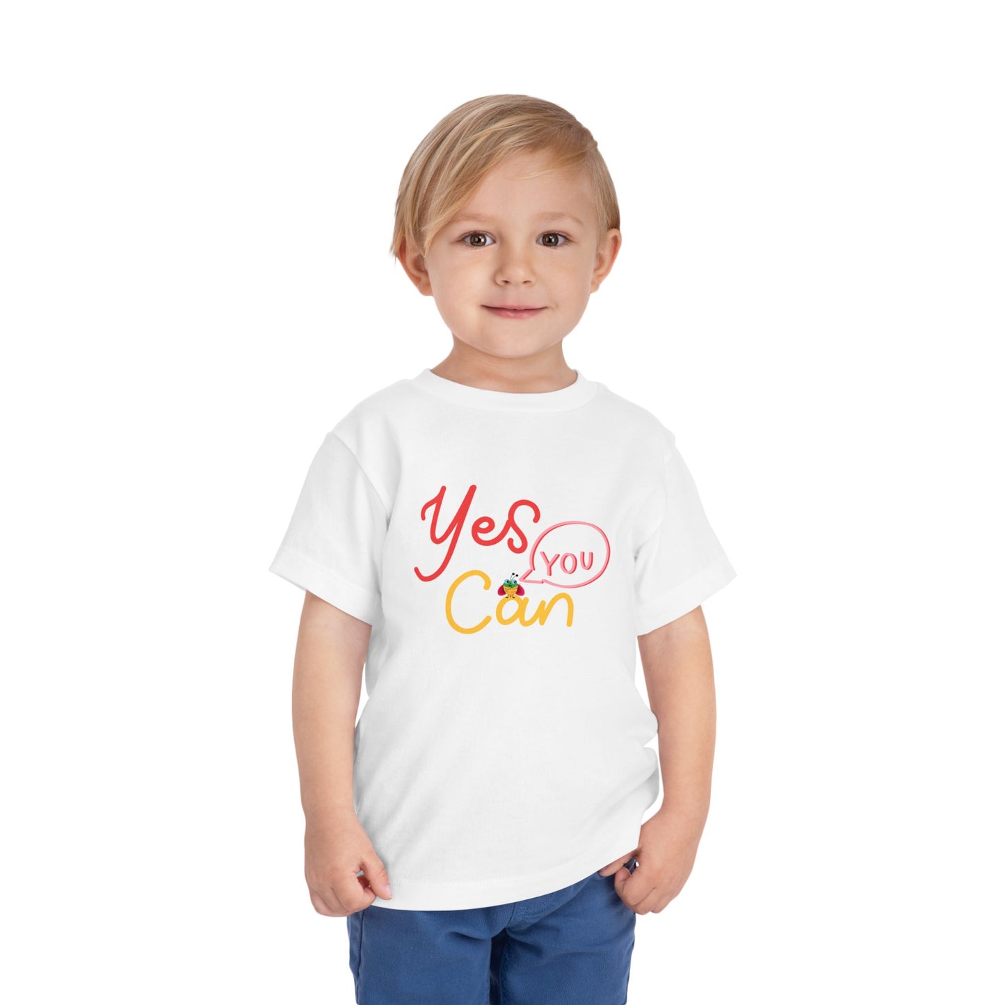 Toddler wearing a white t-shirt with 'Yes You Can' text design