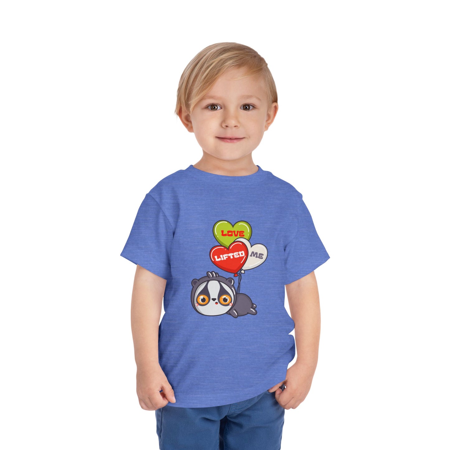 Child wearing a blue toddler t-shirt with a cartoon sloth being carried away by heart shaped balloons that read 'Love Lifted Me'